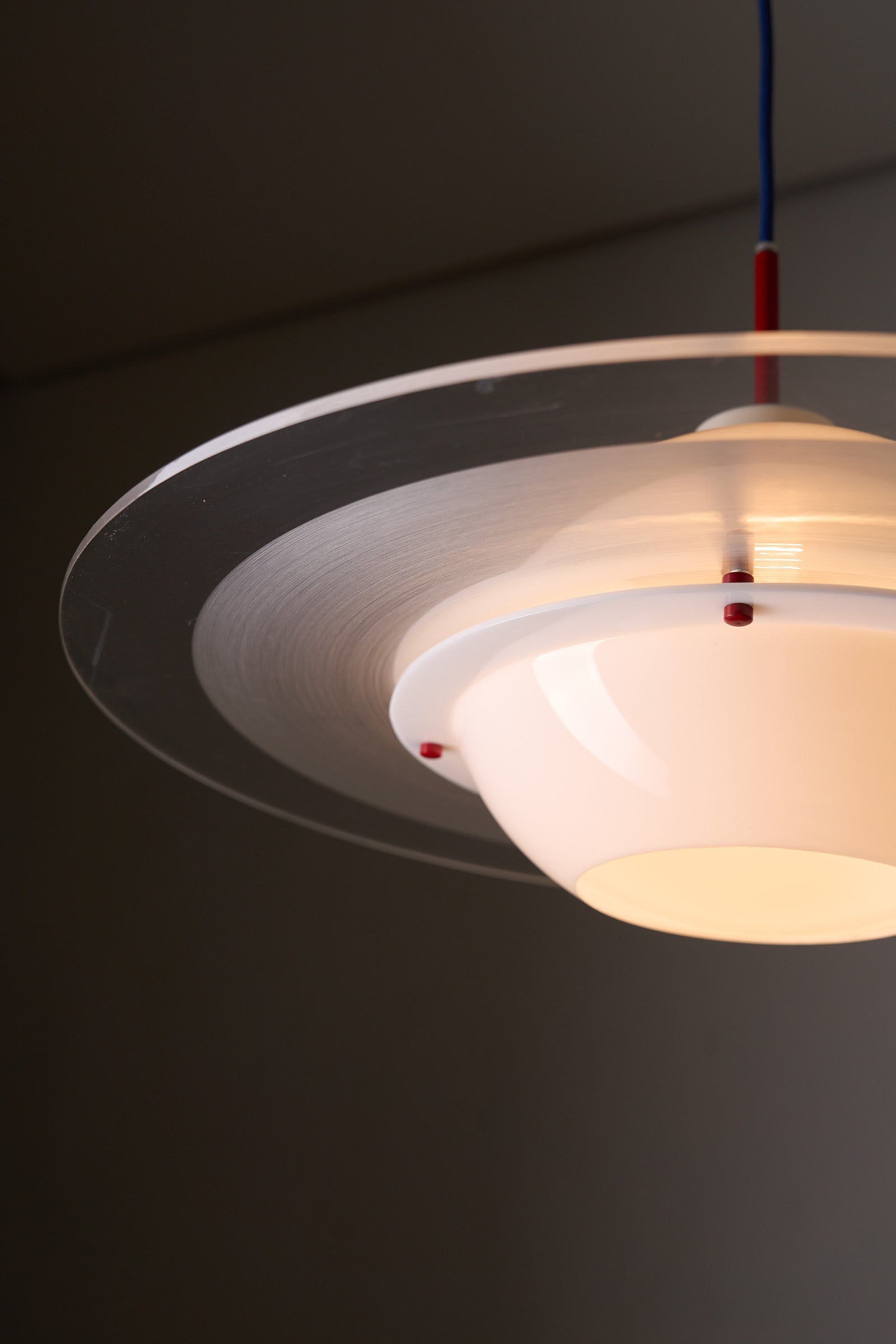 Space Age 'Saturn' Plexiglass Pendant Lamp with Red Details hanging with clear acrylic and red accents.