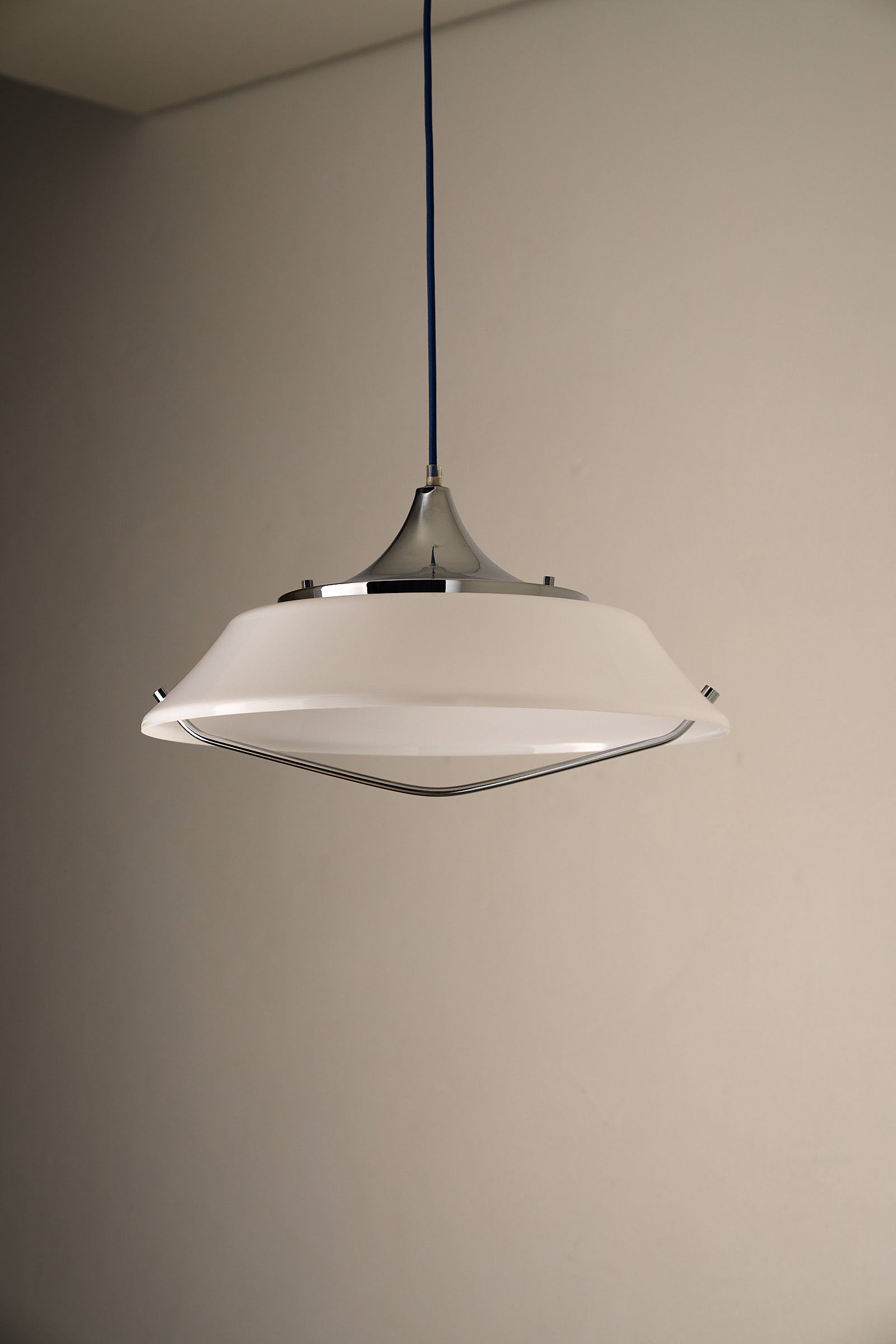 Mid-Century Modern White Acrylic Dish Pendant with Chrome Yoke hanging lamp with polished chrome hardware.