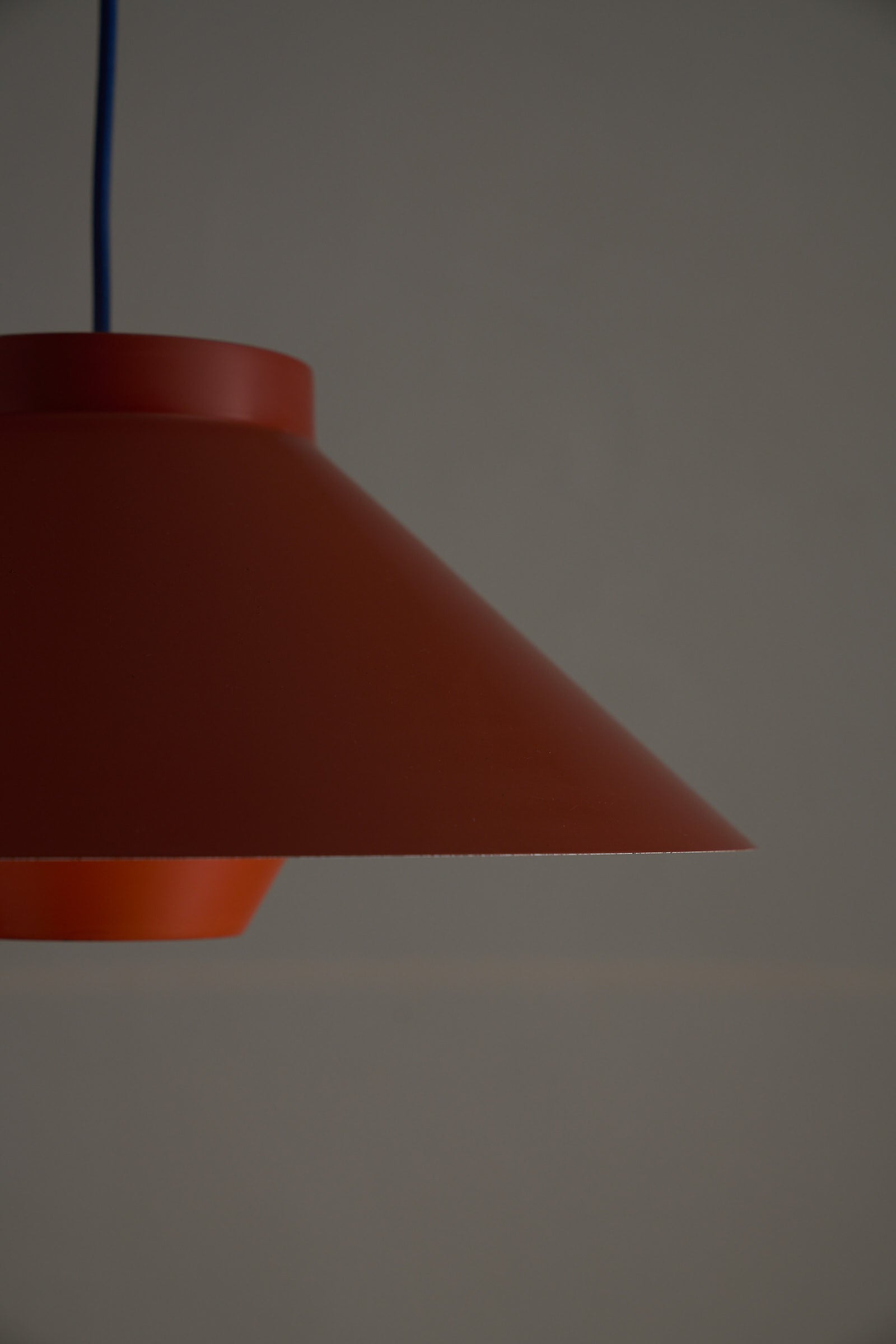1960s Functionalist Layered Pendant Lamp in Stone Red, showcasing a wide conical shade in earthy red.