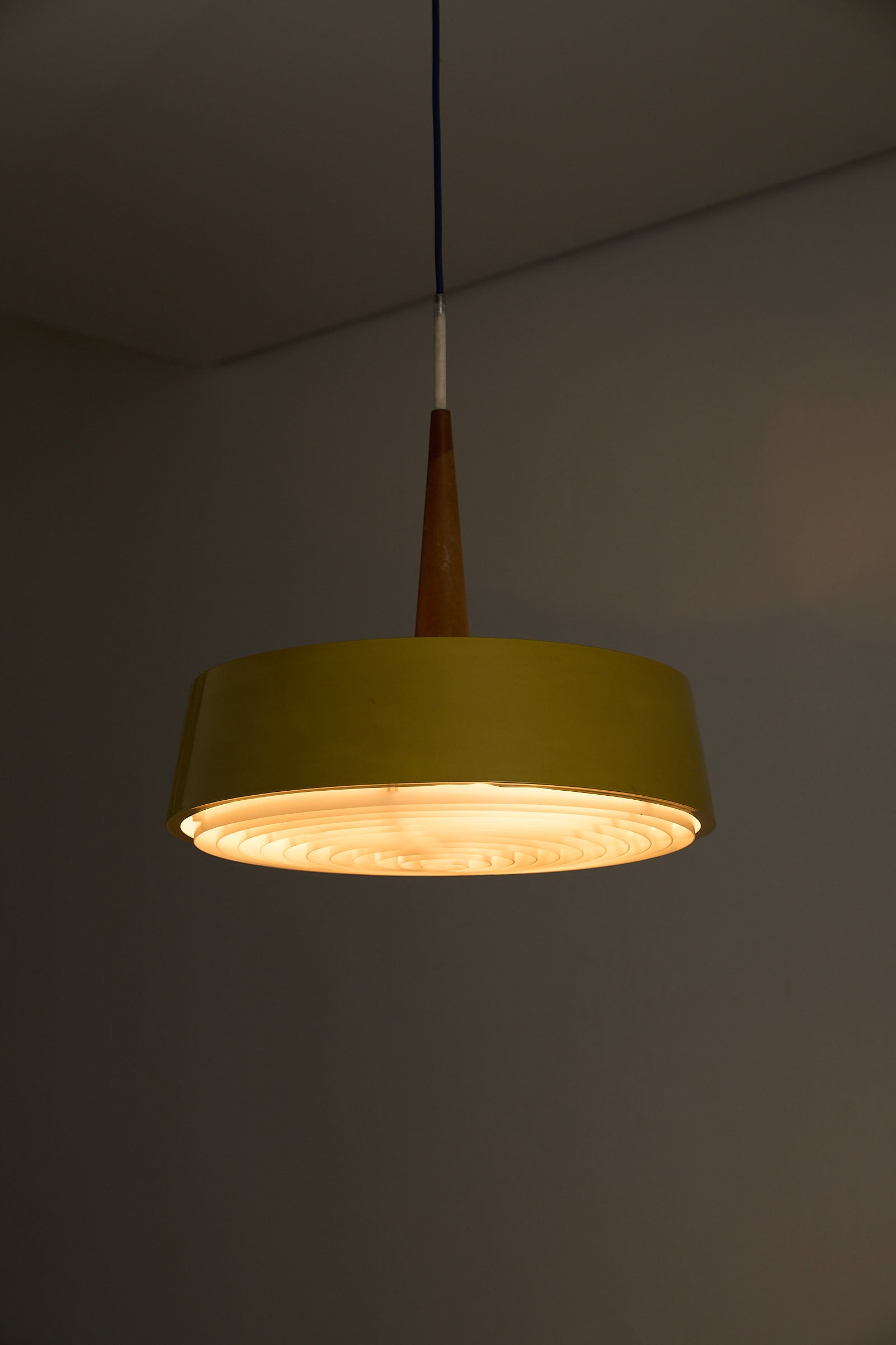 Pendant Lamp in Yellow with Teak Accent featuring a drum-shaped shade and warm teak wood stem.
