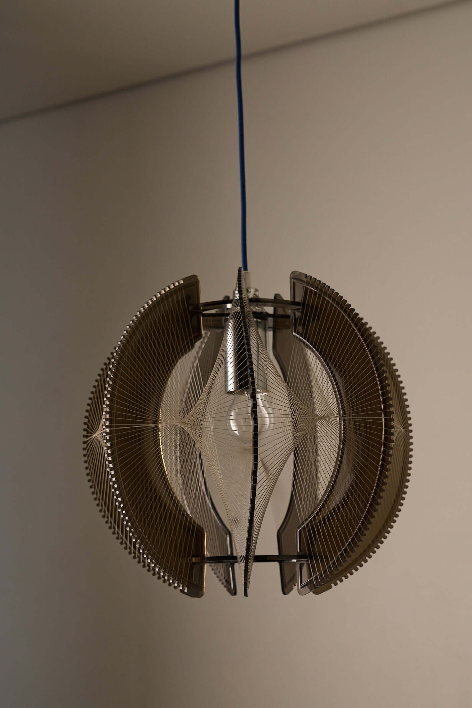 Paul Secon String Art Pendant Lamp featuring interlocking segments and nylon strings for light refraction.