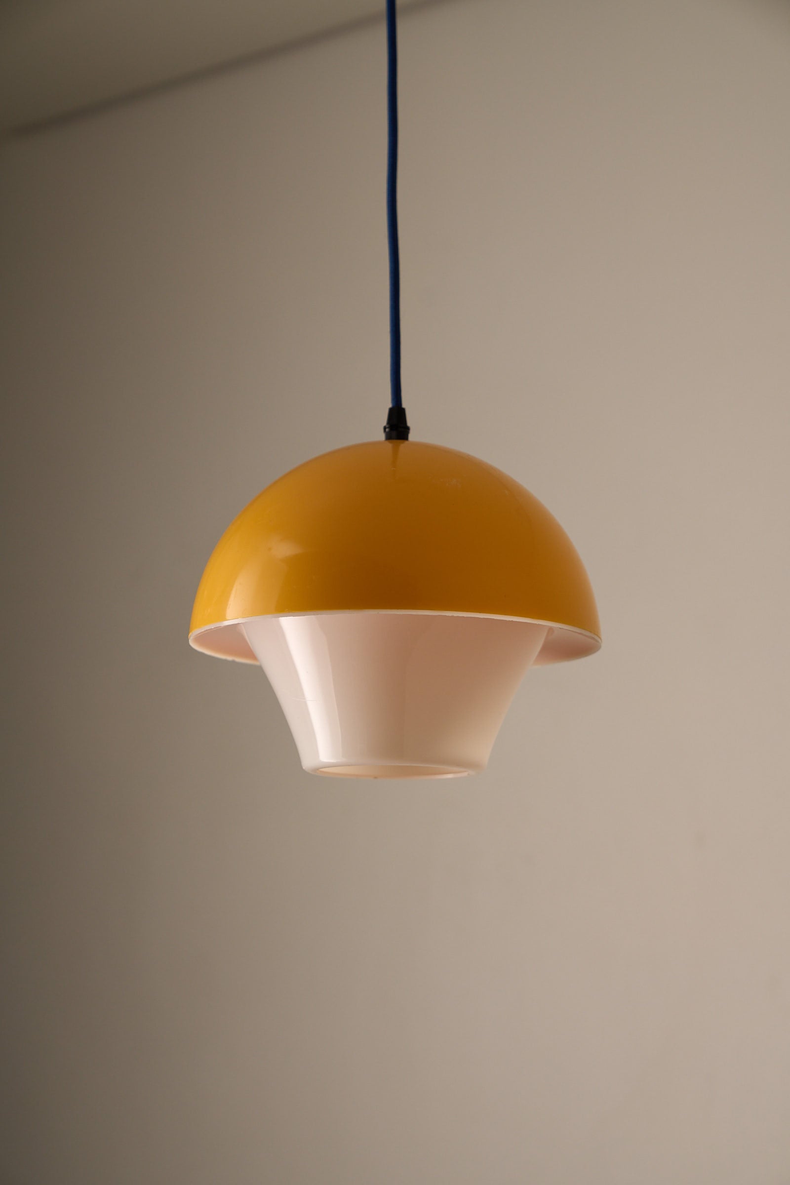Space Age Mushroom Pendant in Yellow-Orange showcasing layered acrylic design with yellow-orange dome and white diffuser.