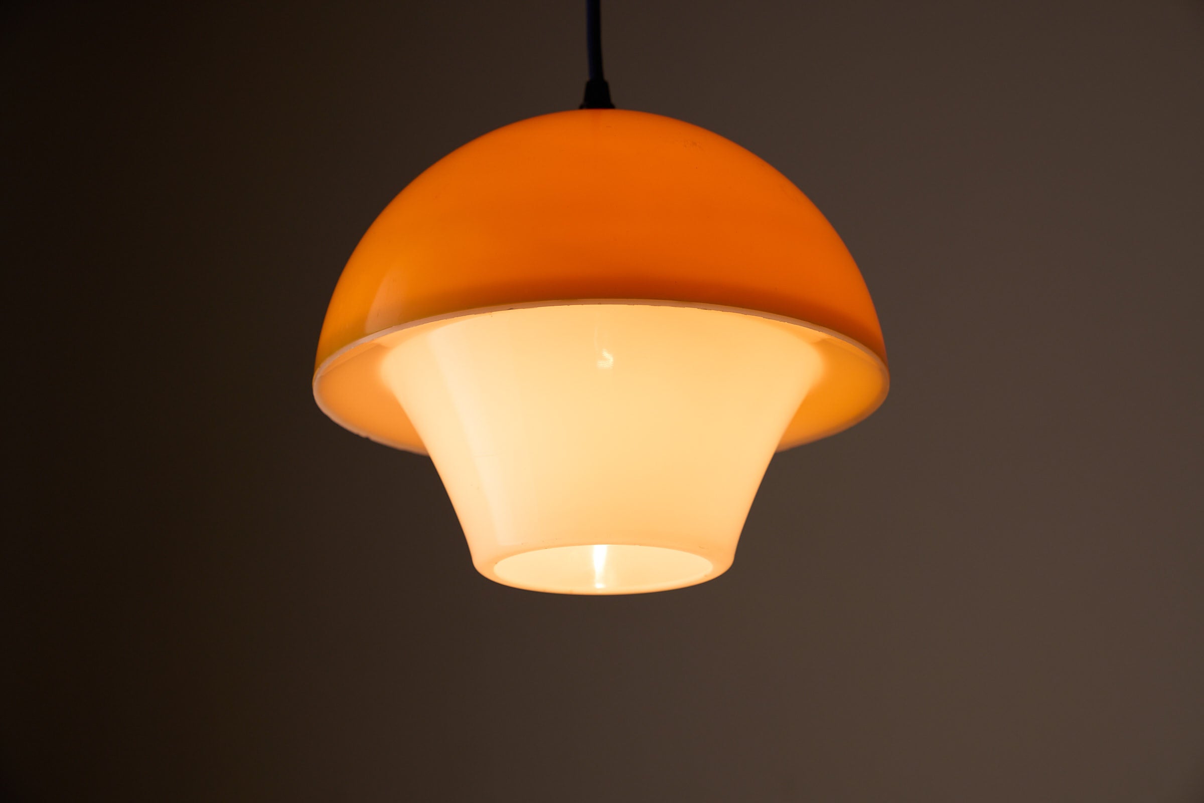 Space Age Mushroom Pendant in Yellow-Orange featuring layered acrylic shades and warm light diffusion.