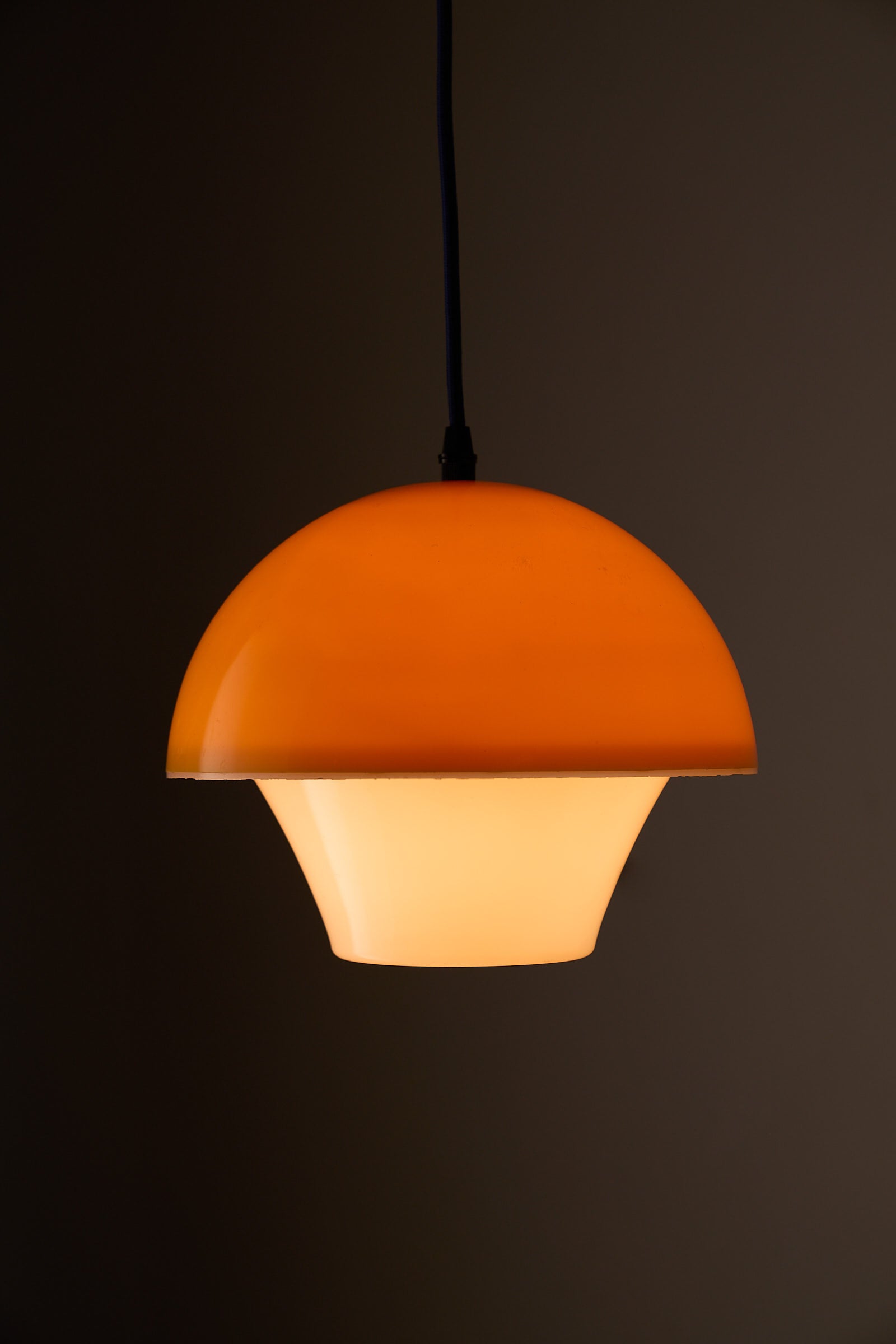 Space Age Mushroom Pendant in Yellow-Orange with layered acrylic shades and warm light.