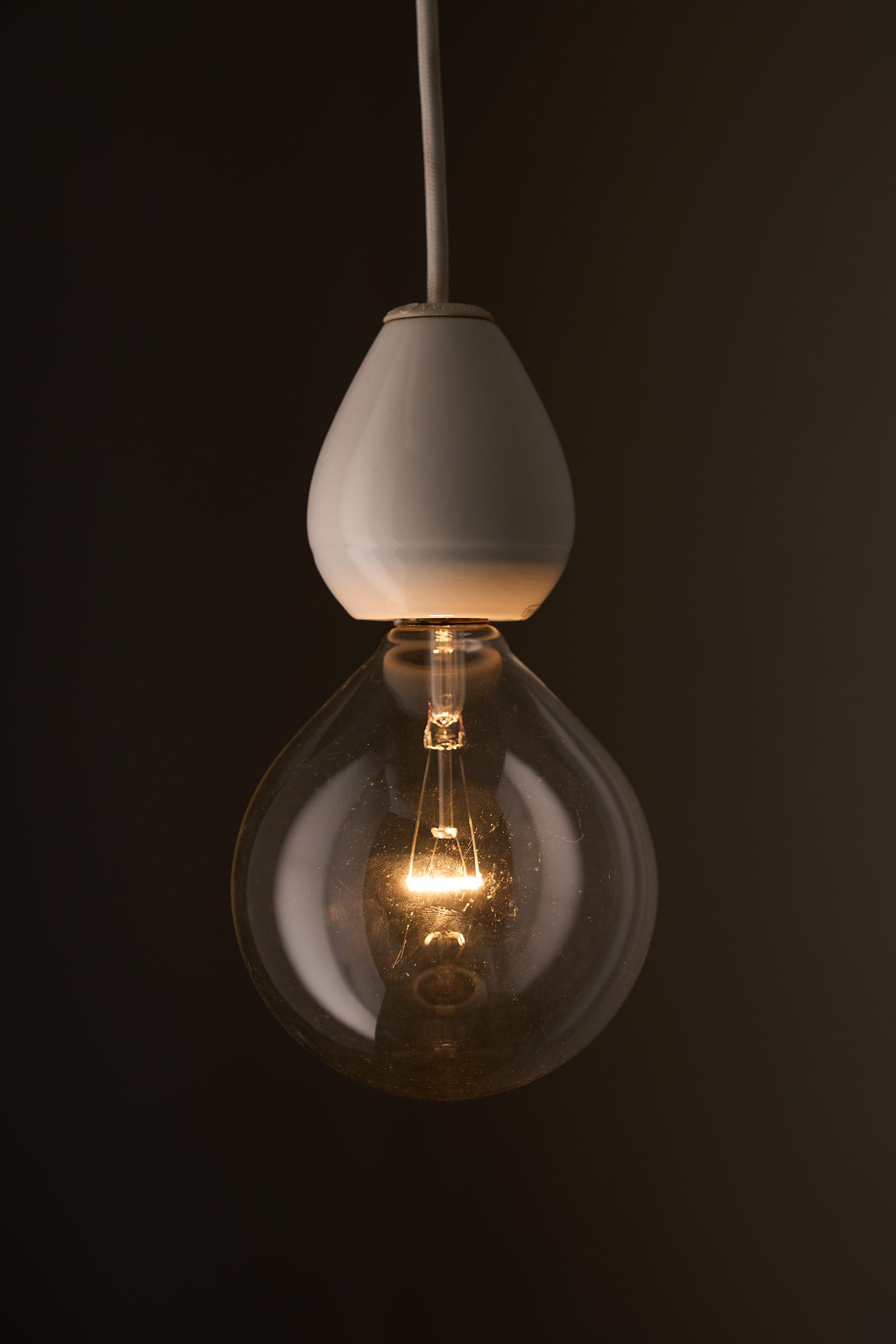 Valerio Sacchetti 'Edison' Pendant Lamp for Sirrah showcasing a white porcelain and glass bulb design.