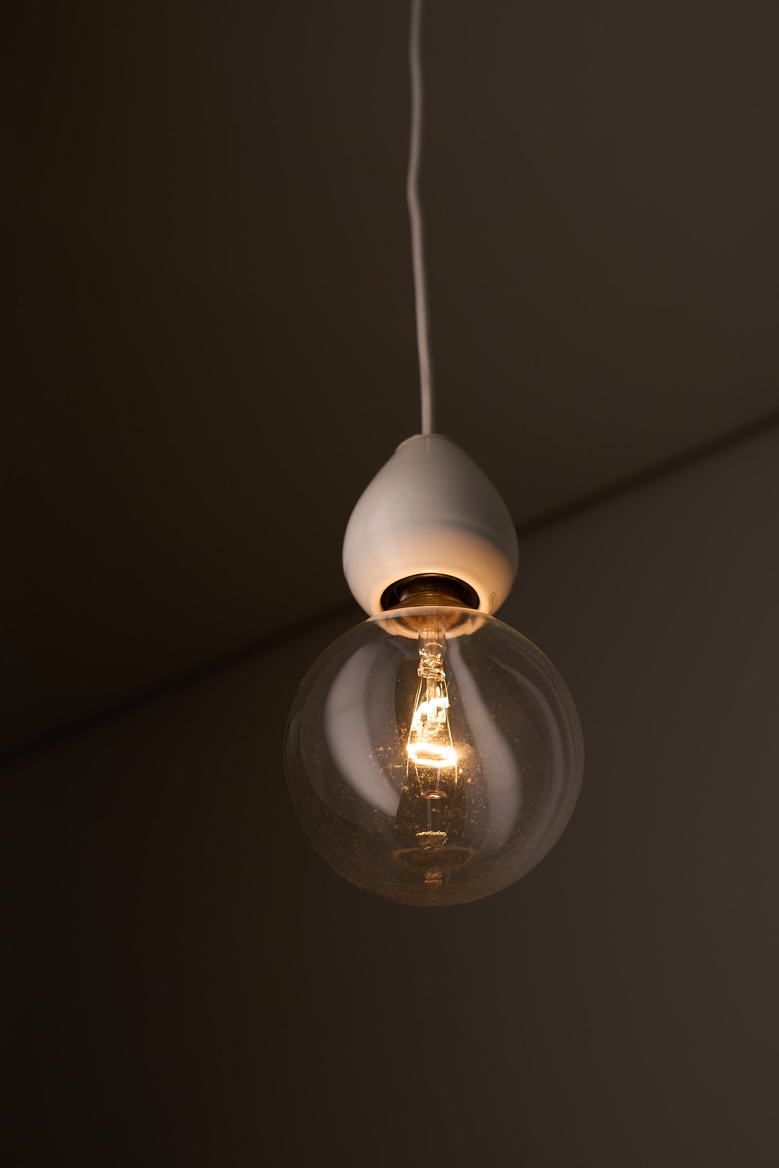 Valerio Sacchetti 'Edison' Pendant Lamp for Sirrah in white porcelain and glass, showcasing a single bulb design.