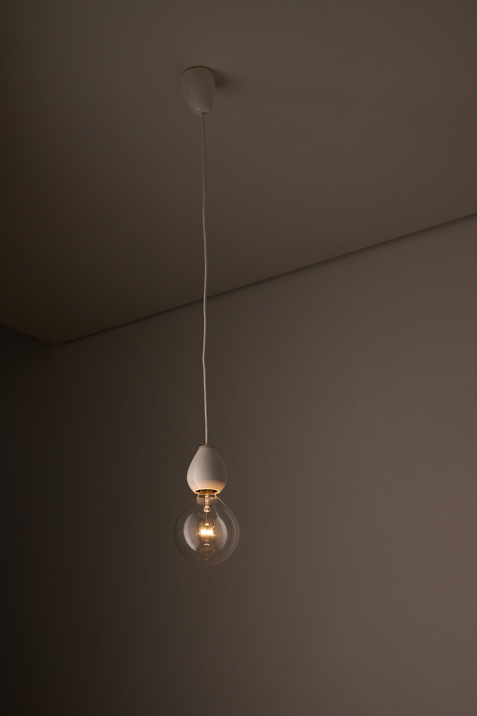 Valerio Sacchetti 'Edison' Pendant Lamp for Sirrah hanging in an elegant interior setting, showcasing its beautiful design.