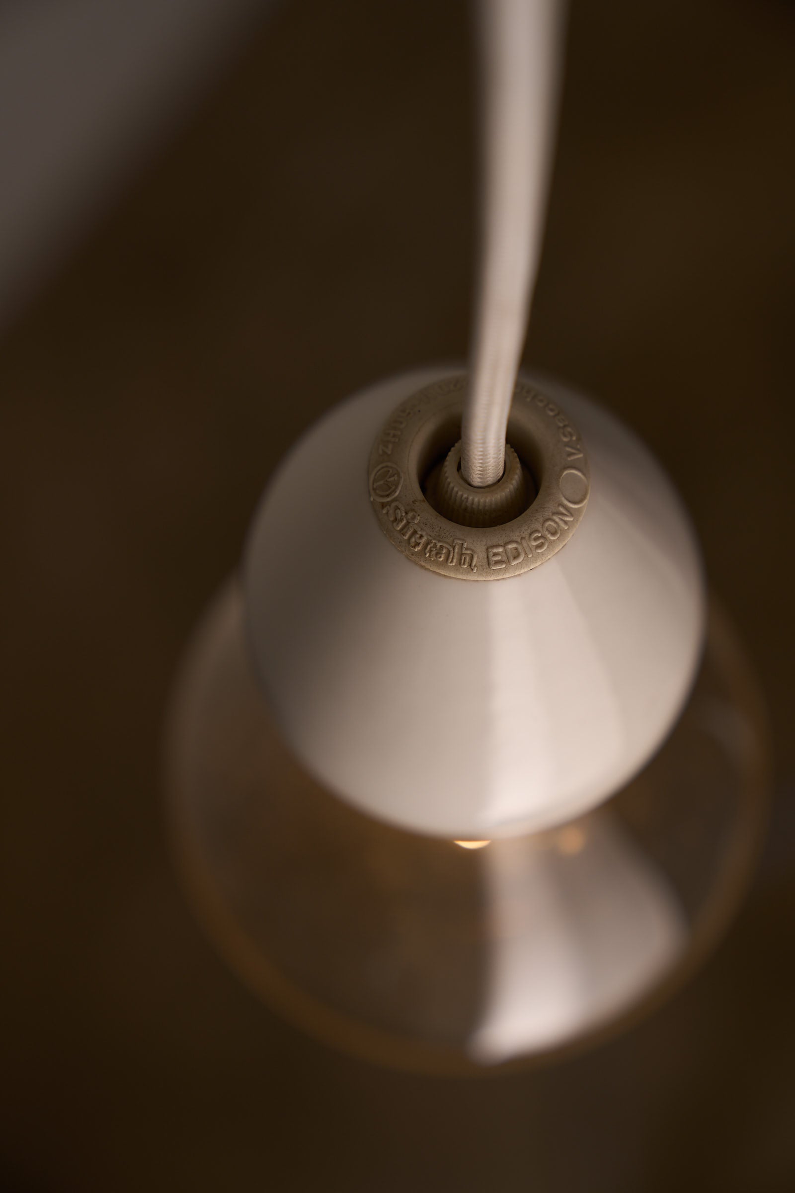 Valerio Sacchetti 'Edison' Pendant Lamp for Sirrah in close-up view, showcasing the white porcelain design and bulb.