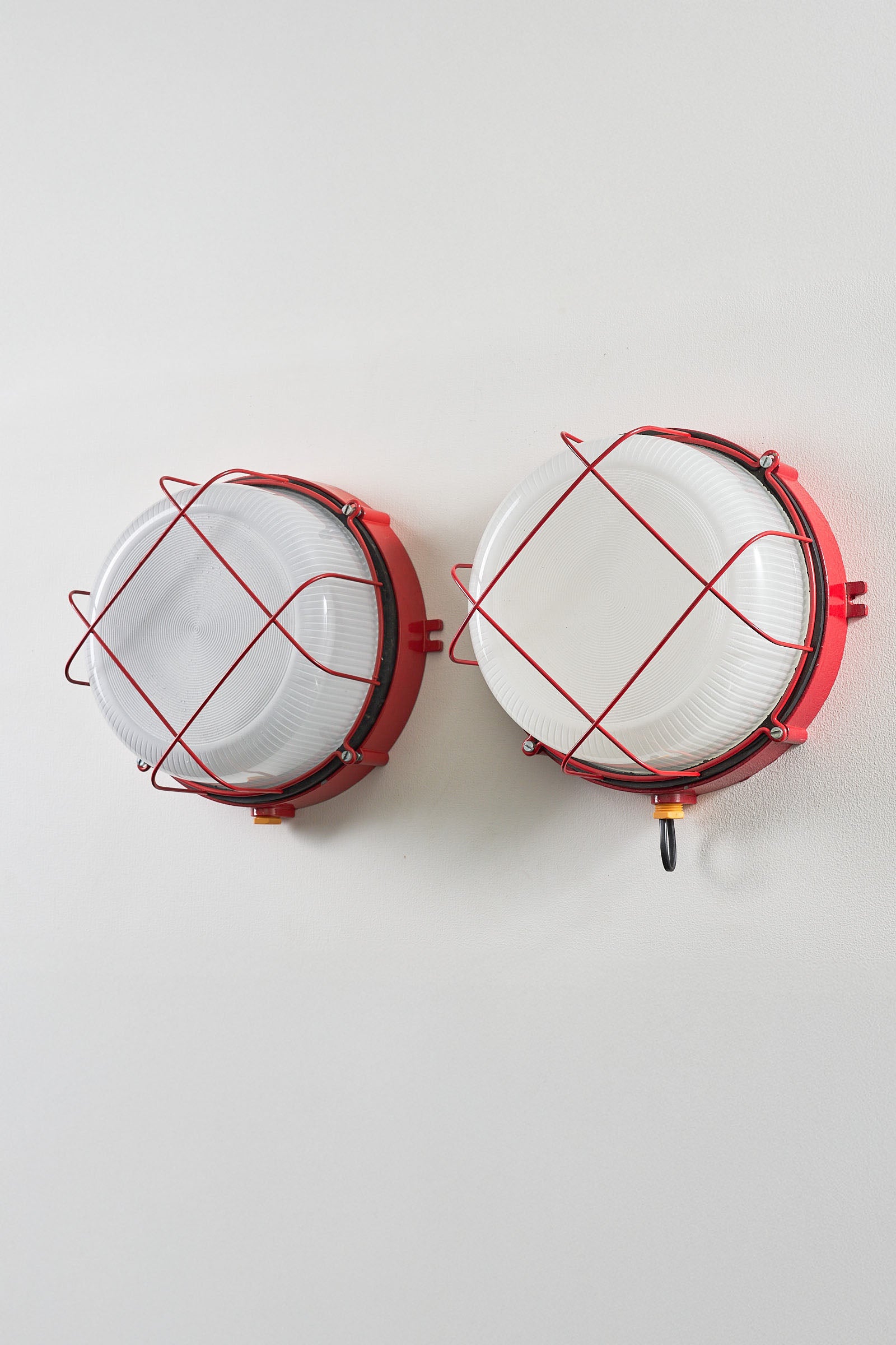 Pair of Red Marine Cage Lamps (set) - Vintage industrial flush mount lights with red enameled finish.
