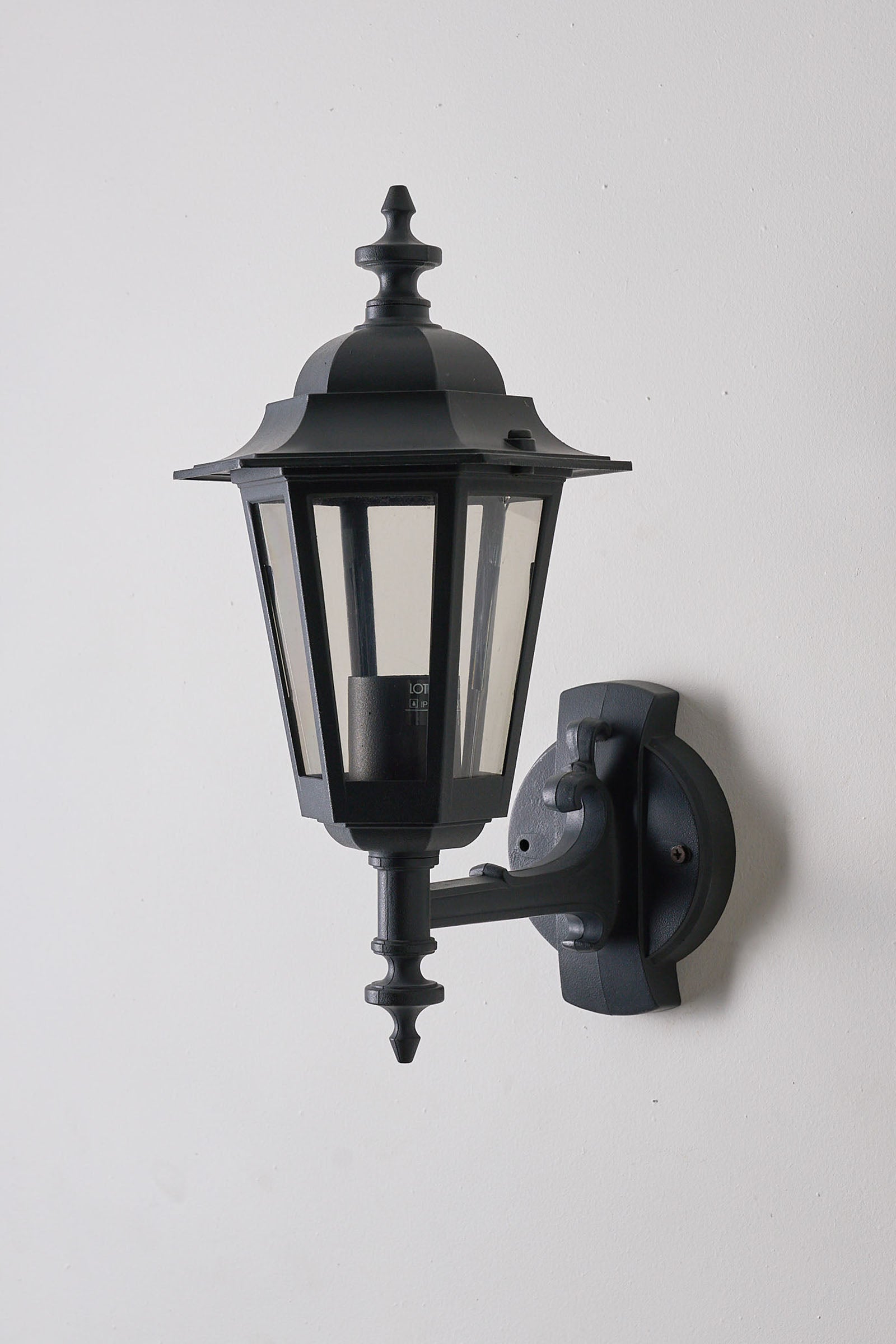 Pair of Traditional Outdoor Wall Lamps by Lothus (set) featuring a classic black lantern design for outdoor lighting.