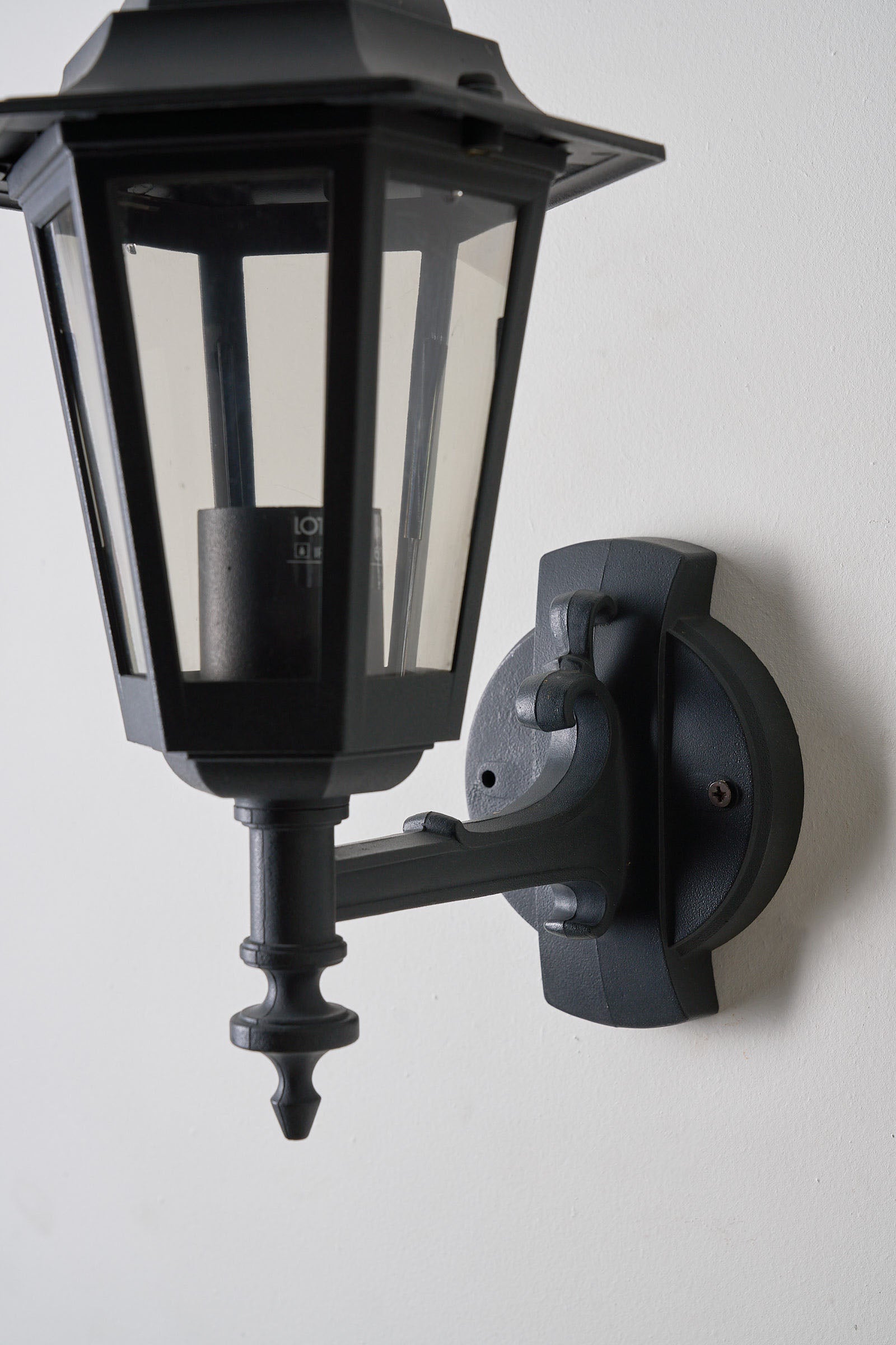 Pair of Traditional Outdoor Wall Lamps by Lothus (set) featuring a classic lantern design for outdoor lighting.