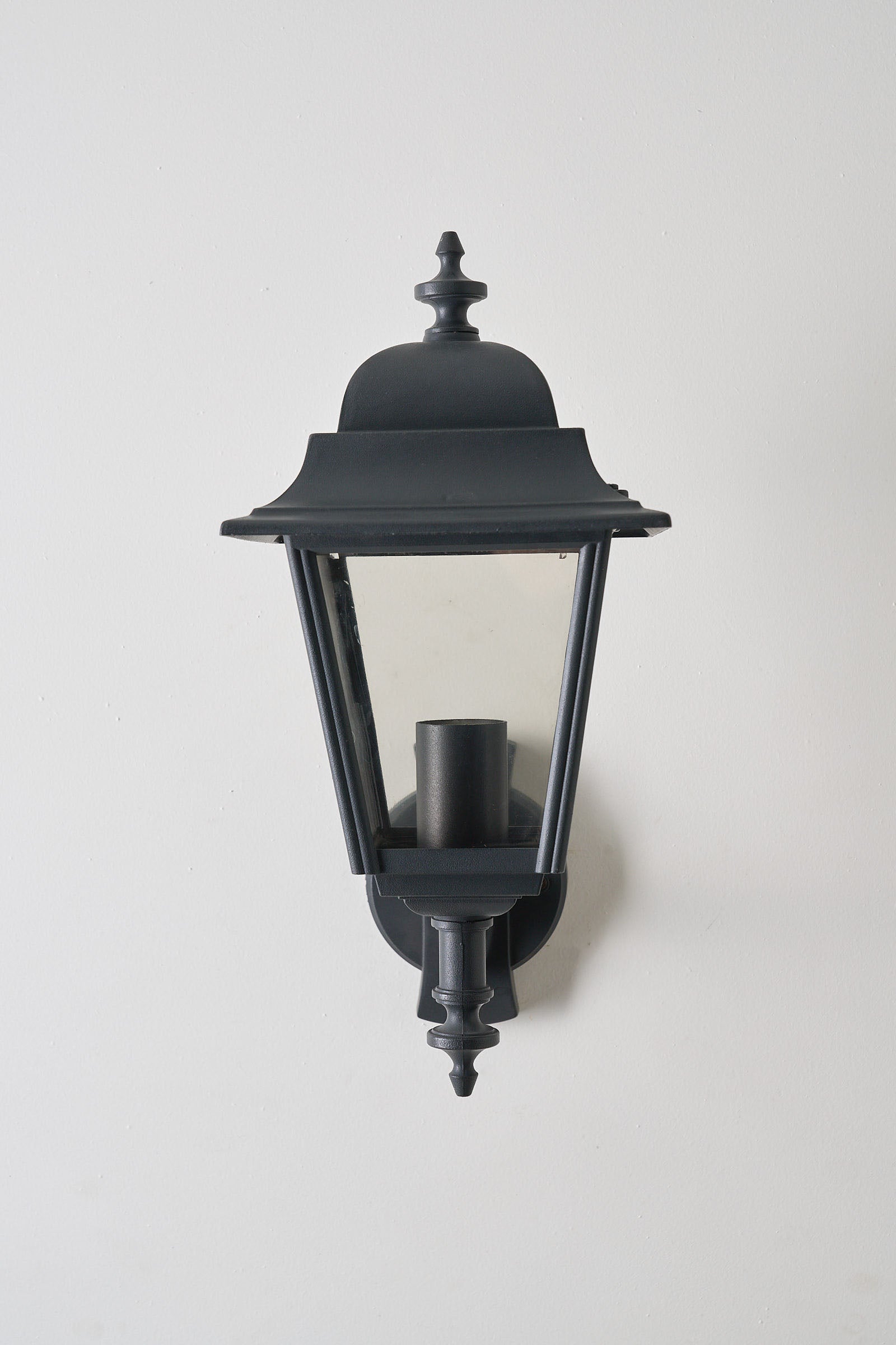 Traditional Outdoor Wall Lantern by Lothus - Black lacquered metal outdoor lighting with clear glass.