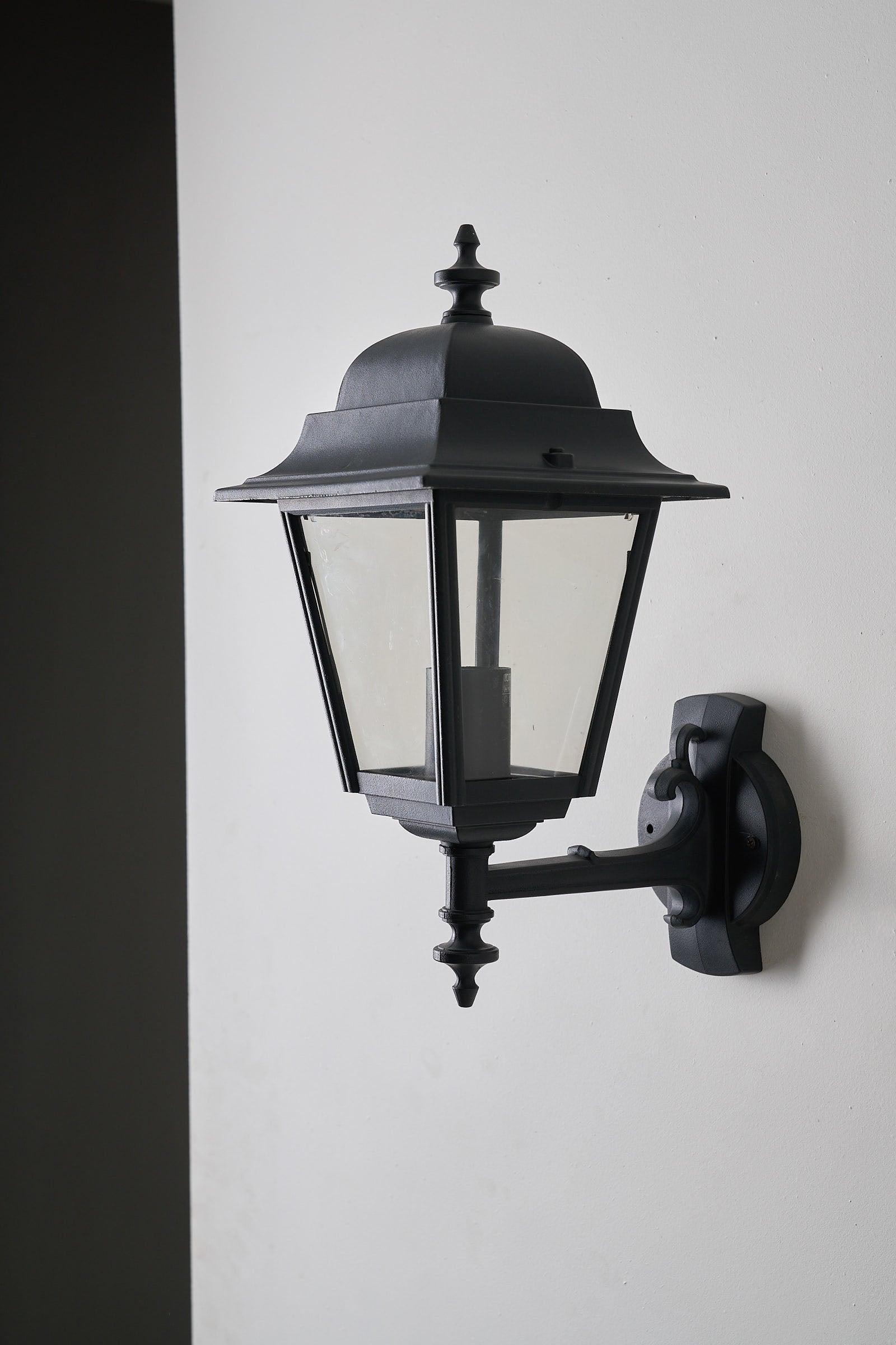 Traditional Outdoor Wall Lantern by Lothus in black lacquered metal for outdoor lighting
