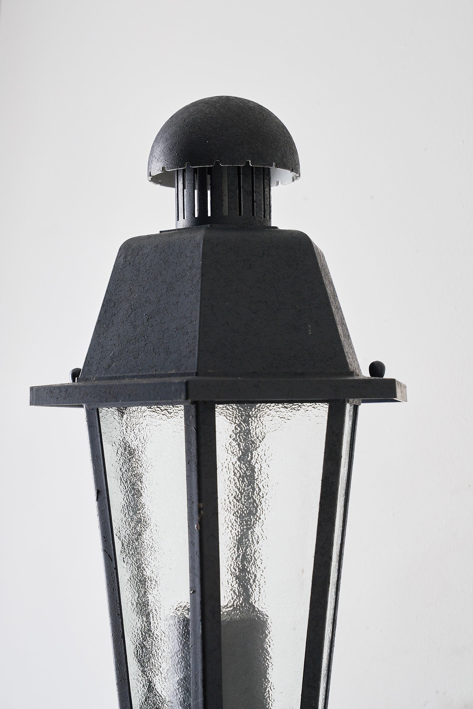 Outdoor Wall Lantern Bega Boom Traditional Style top view with bubbled glass panels and dark metal finish.