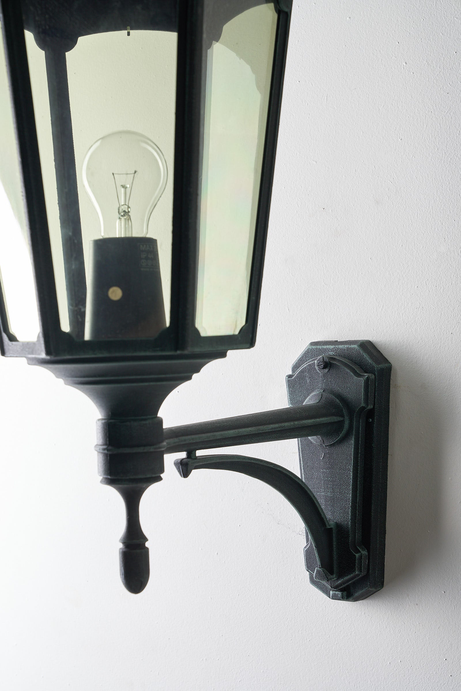 Large Traditional Outdoor Wall Lantern by Noral, 70cm height mounted on a wall with a clear bulb visible.