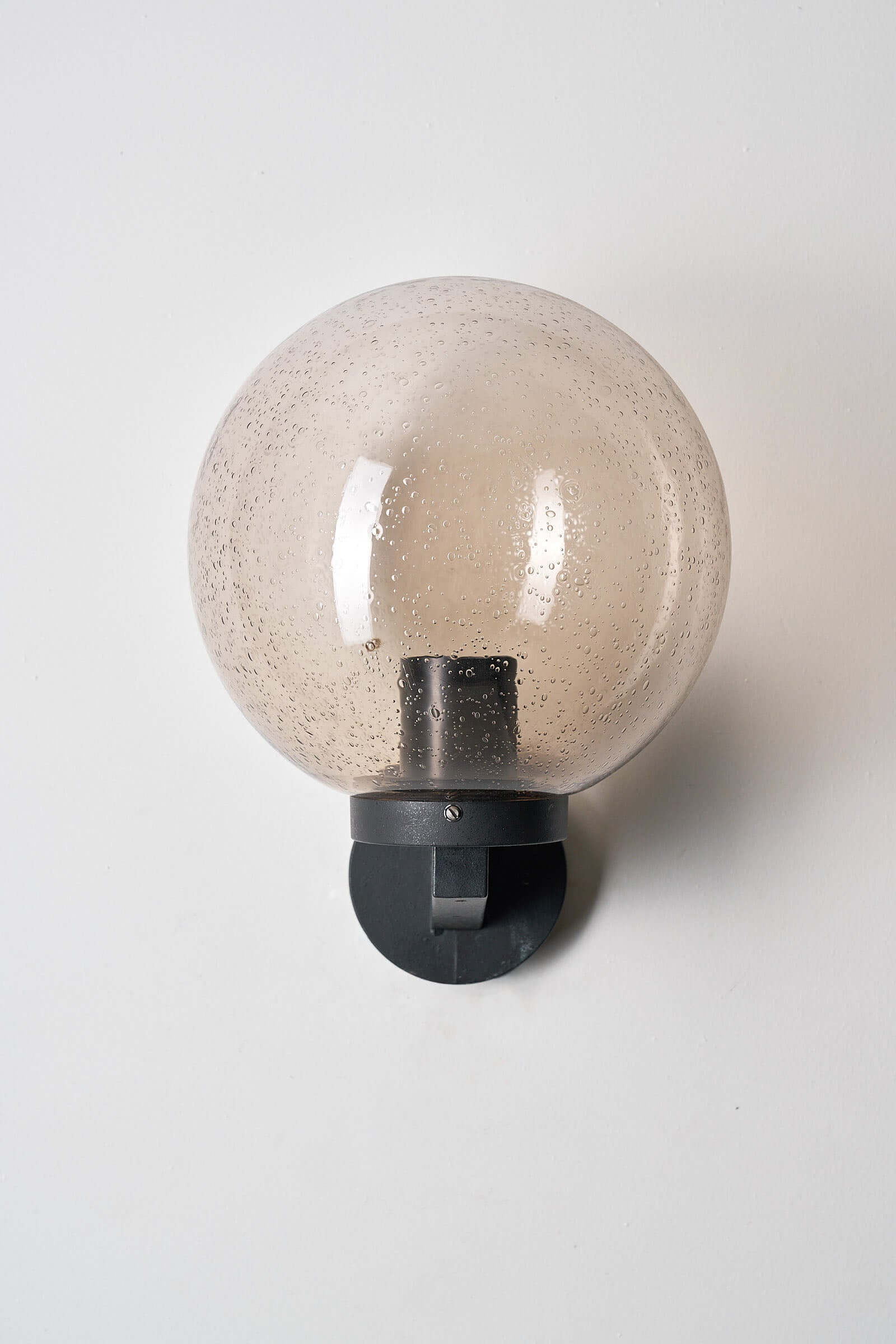 Outdoor Glass Globe Wall Light by Bega Boom featuring a spherical glass shade and dark cast metal base.