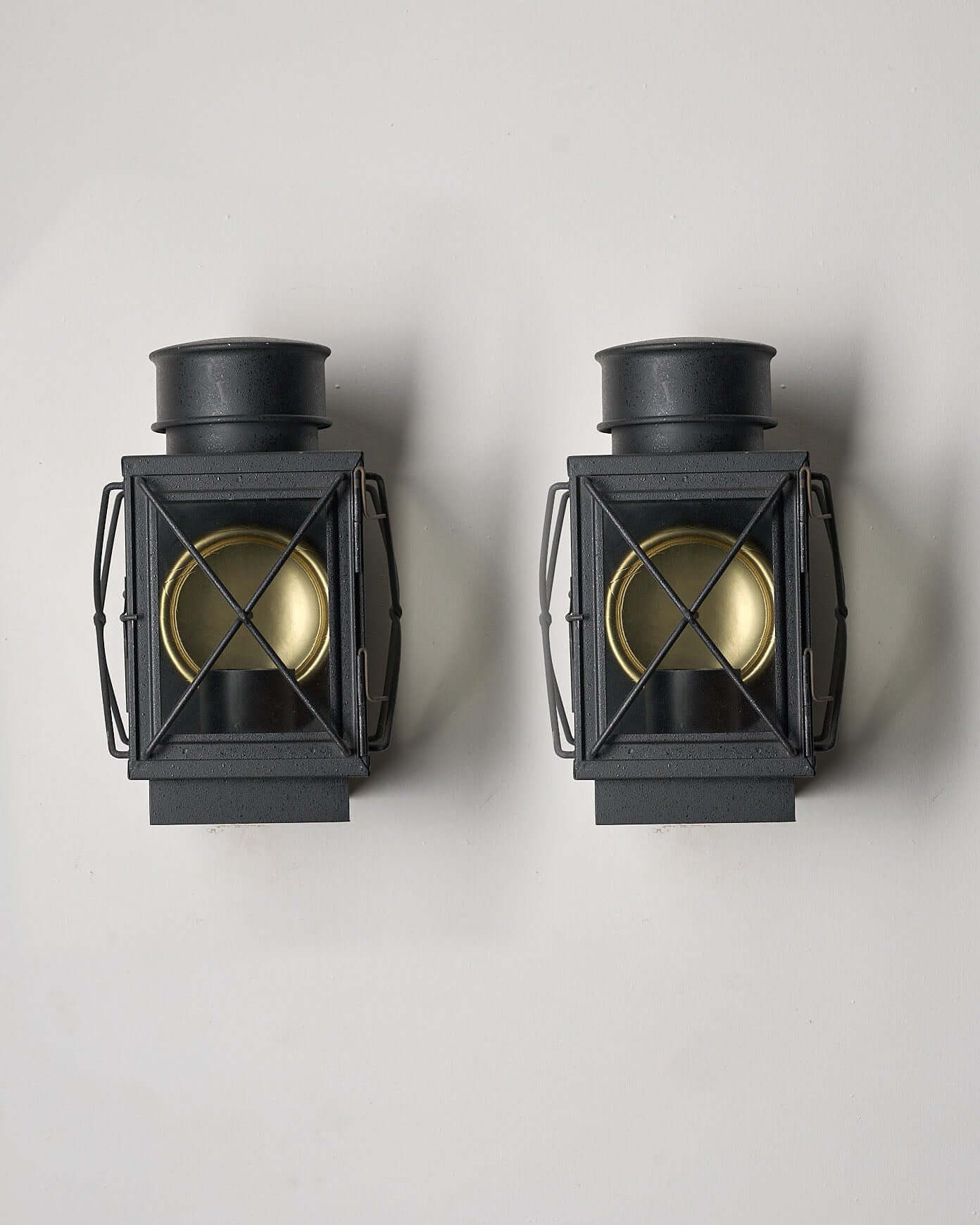 Set of Caged Lantern Wall Lamps by Bega Boom - stylish outdoor lamp with dark cast metal body and brass reflector.