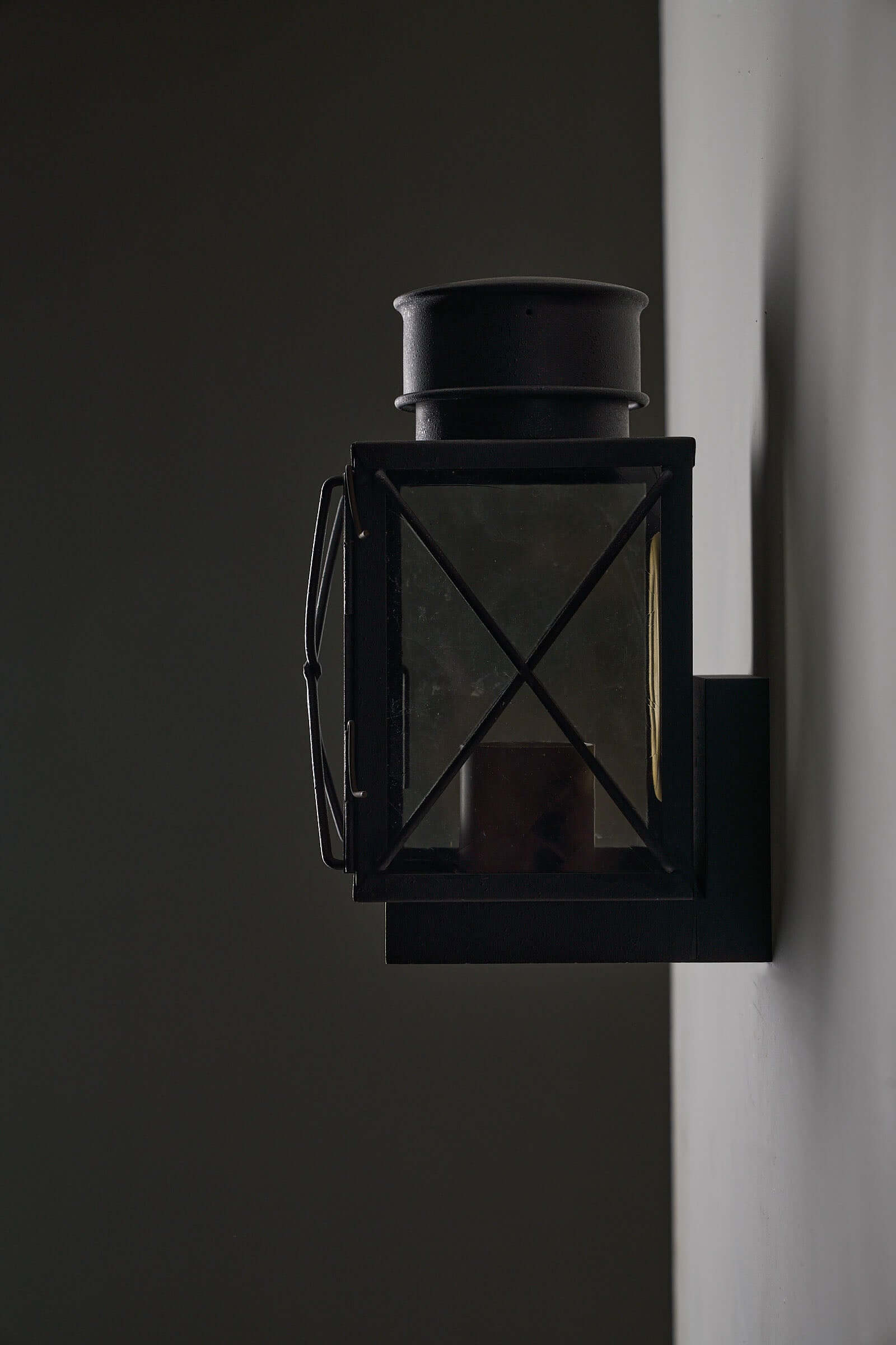 Set of Caged Lantern Wall Lamps by Bega Boom - Outdoor lamp featuring dark cast metal and clear glass panes.