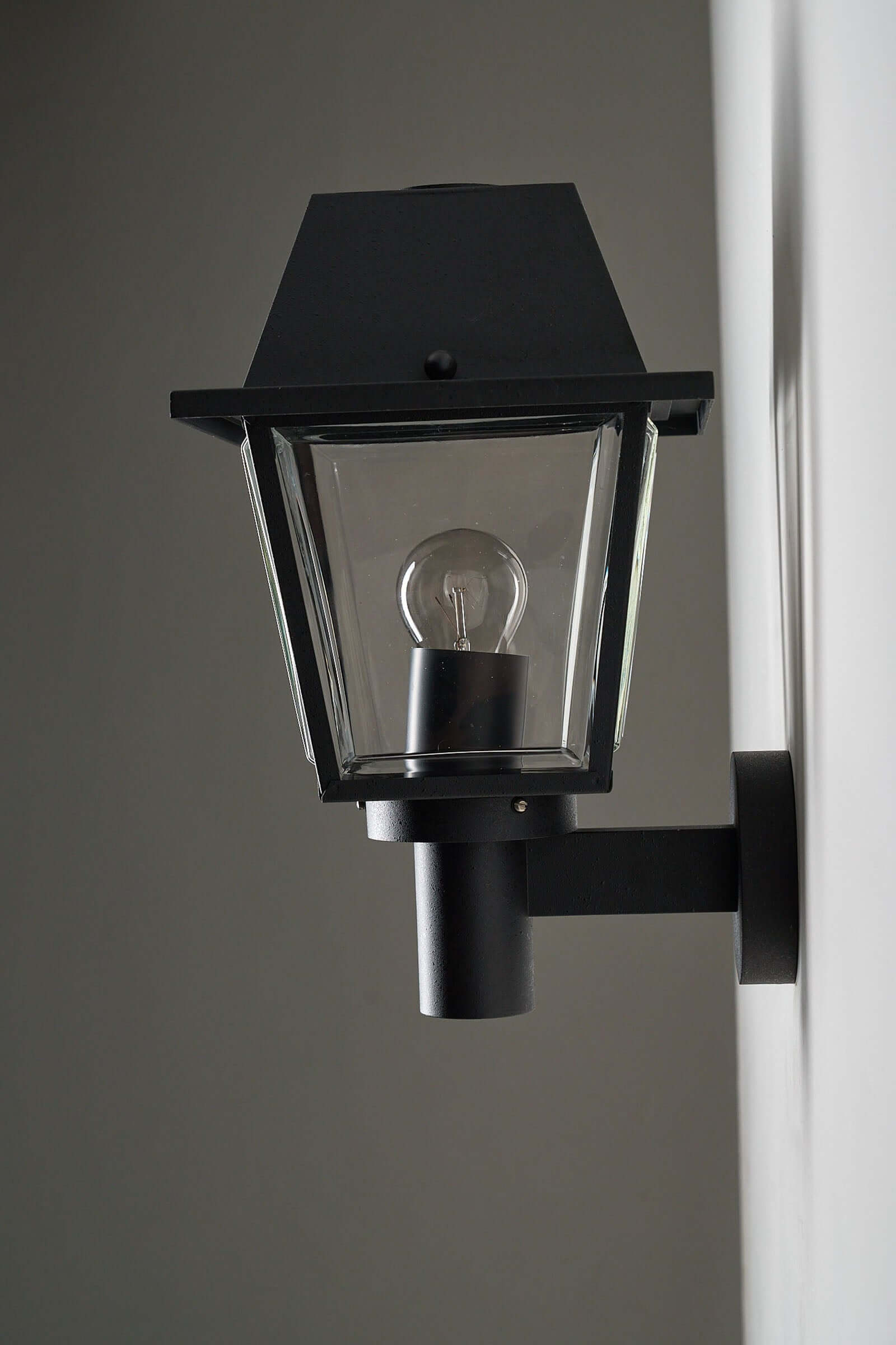 Outdoor Wall Lantern by Bega Boom, a durable outdoor lamp featuring a classic design with clear glass panels.