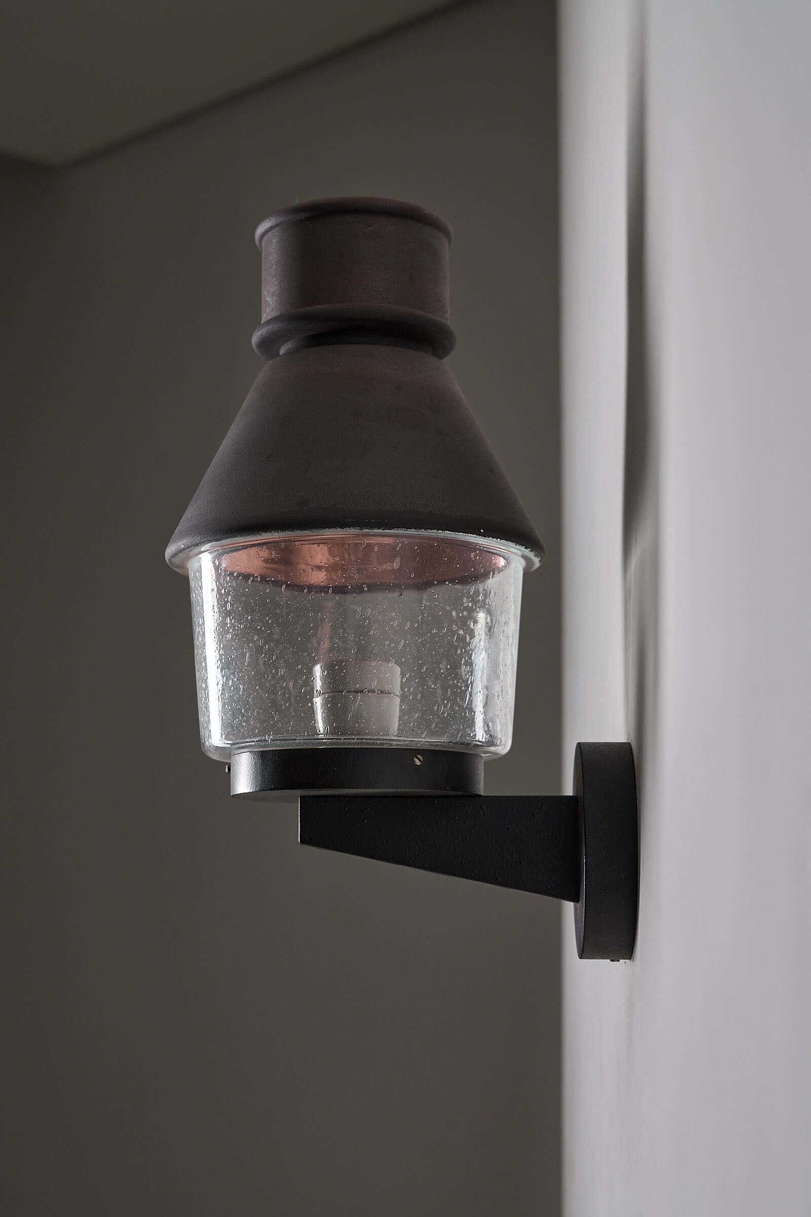 Set of 2 Outdoor Wall Light With Copper Reflector by Bega Boom showcased on a wall, featuring copper and glass design.