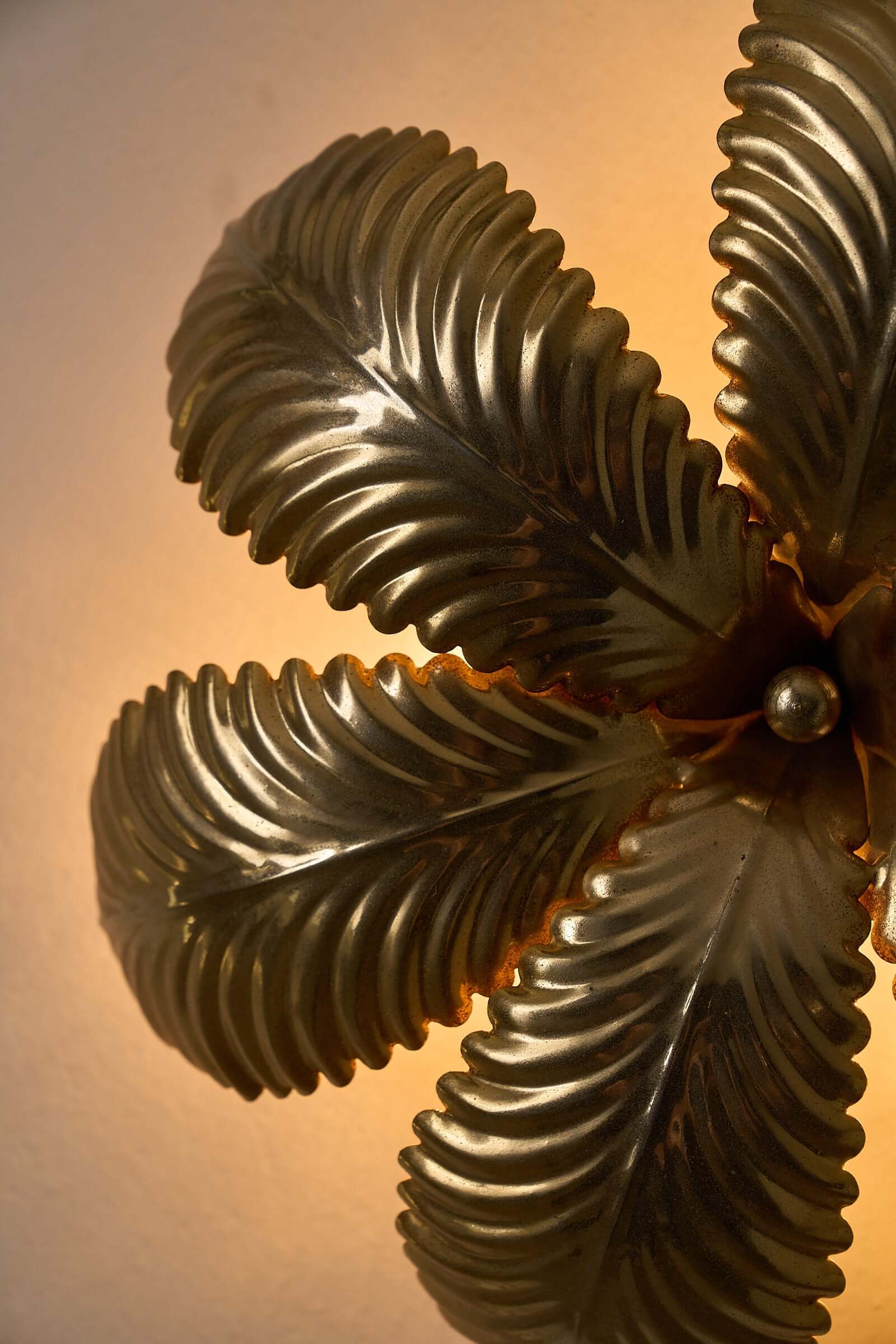 Close-up of Hans Kögl Gilded Palm Leaves Wall Light/Flush Mount showcasing detailed gilded palm leaves.