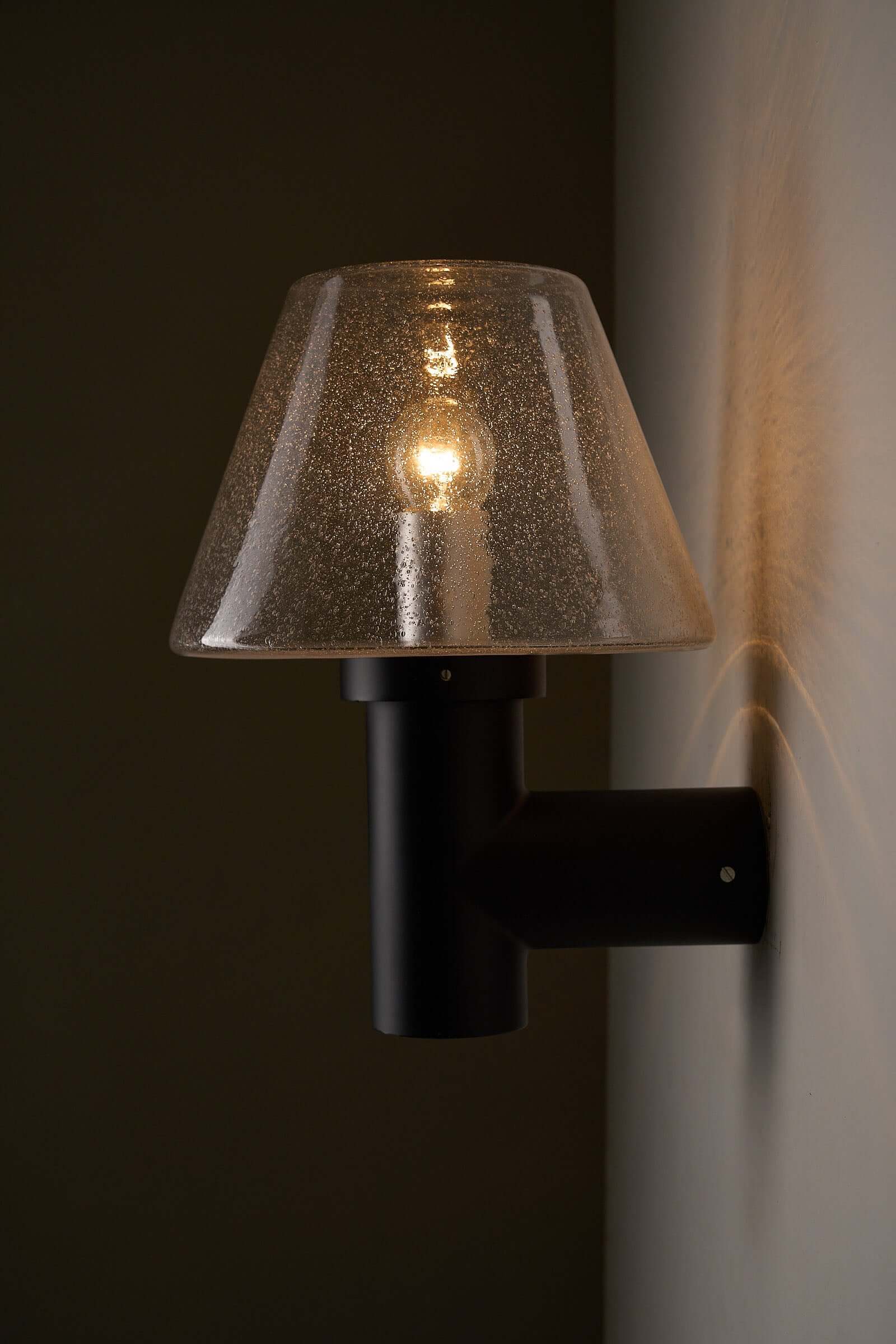 Glashütte Limburg Bubble Glass Outdoor Sconce with smoke-tinted glass shade and dark metal base.