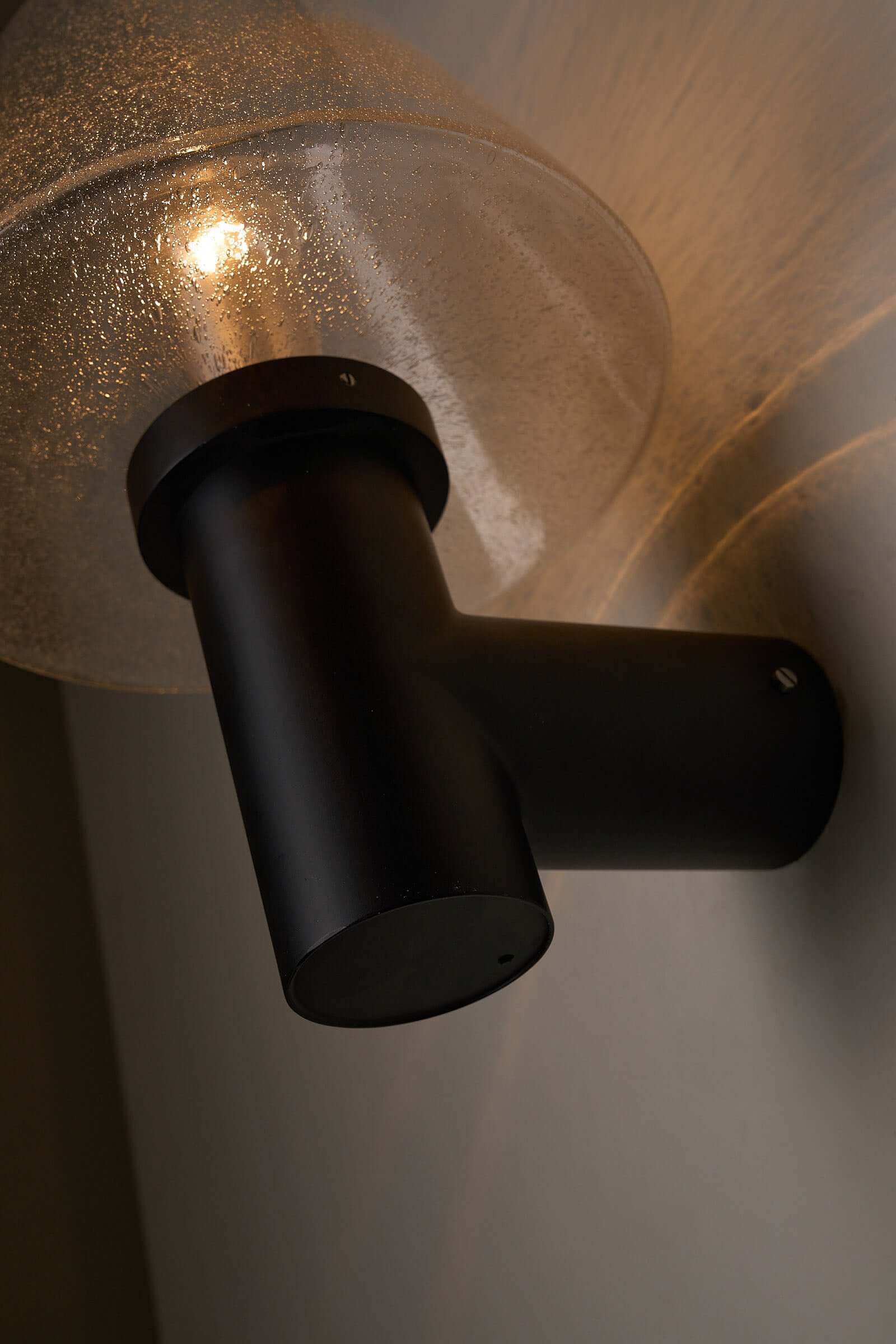 Glashütte Limburg Bubble Glass Outdoor Sconce with smoke-tinted glass and dark cast metal base.