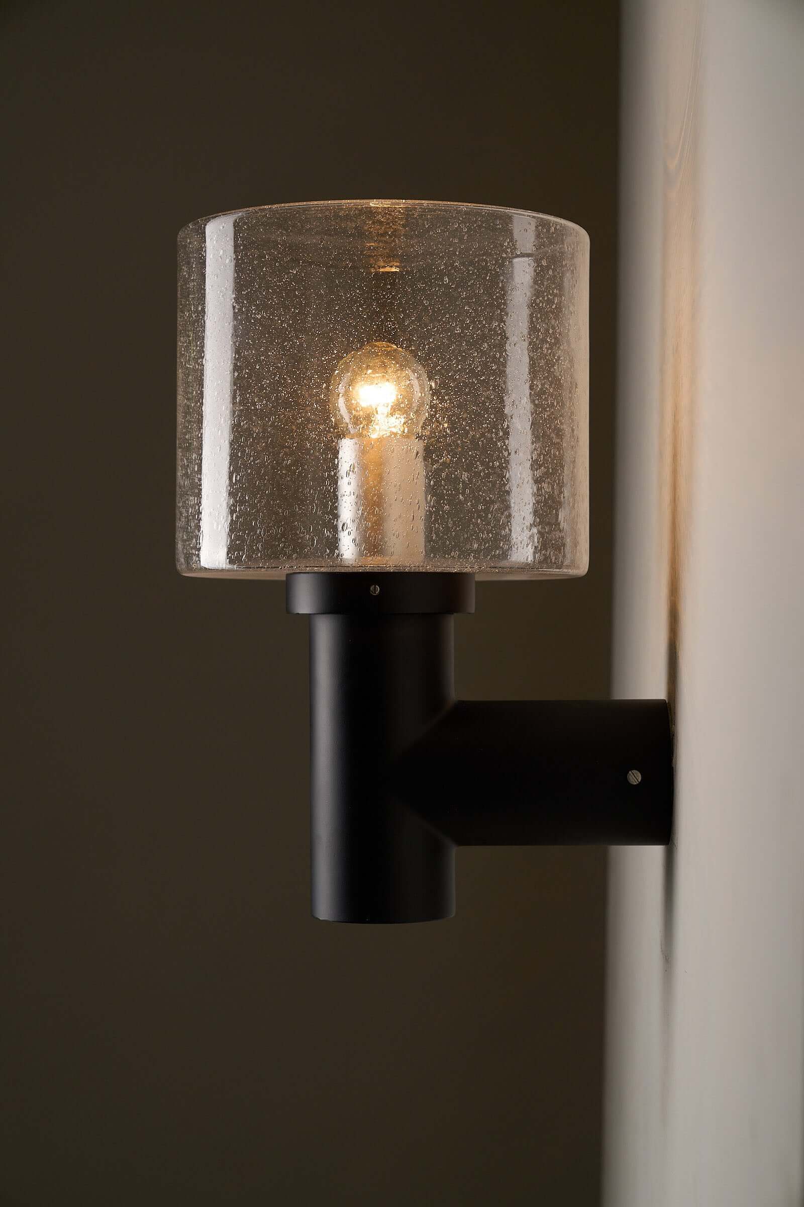 Glashütte Limburg Conical Bubble Glass Outdoor Sconce with smoke-tinted glass and dark cast metal base.
