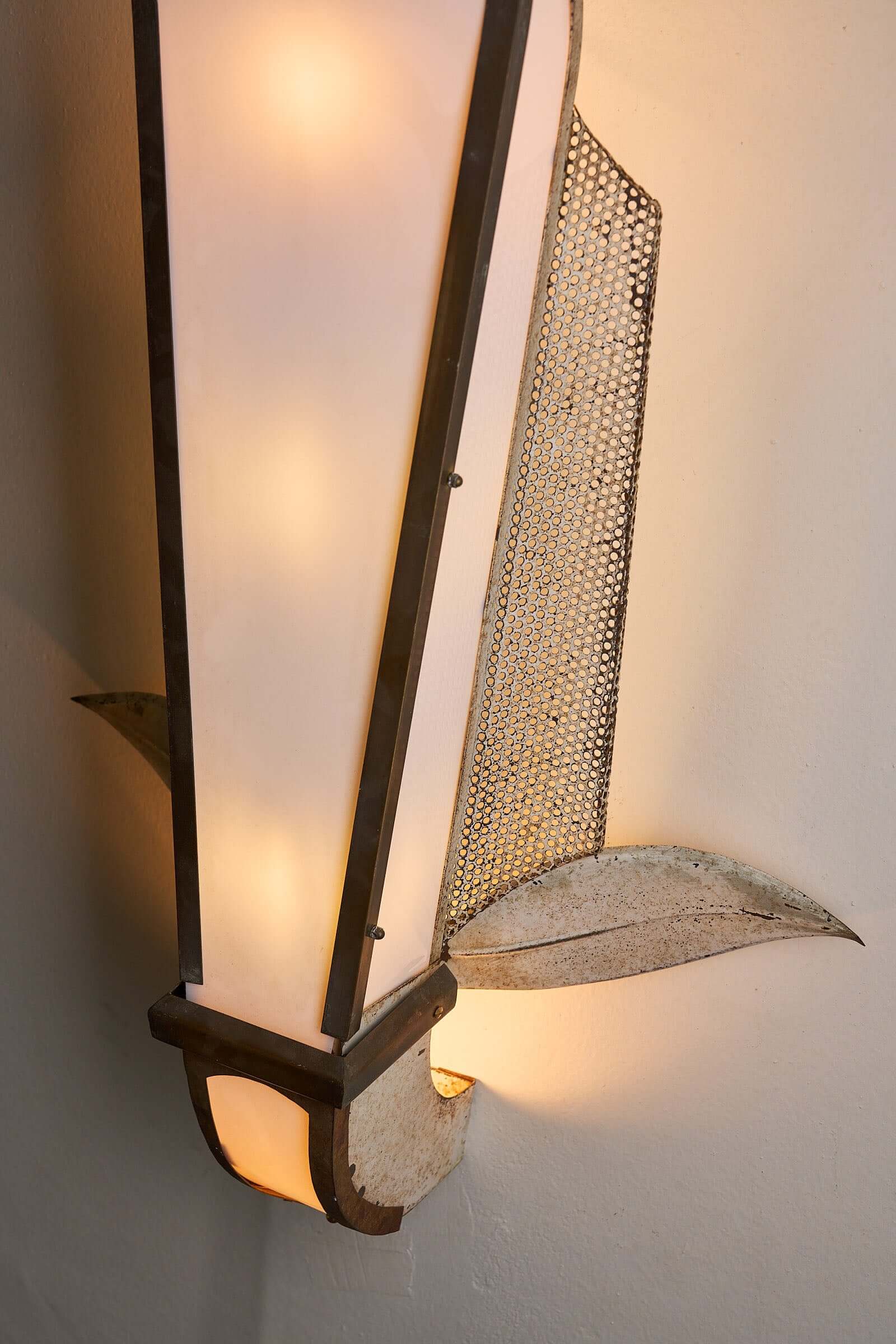 Grand Parisian Art Deco Wall Sconce featuring a tall diffuser, perforated metal, and stylized leaves.