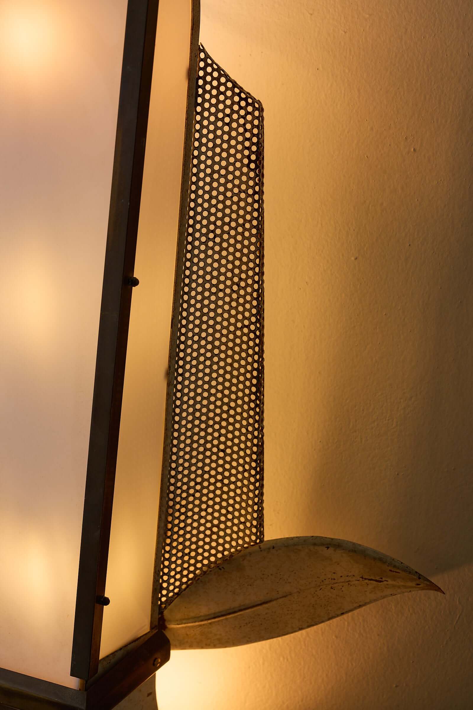 Grand Parisian Art Deco Wall Sconce showing tapered diffuser, perforated steel, and stylized metal leaves.