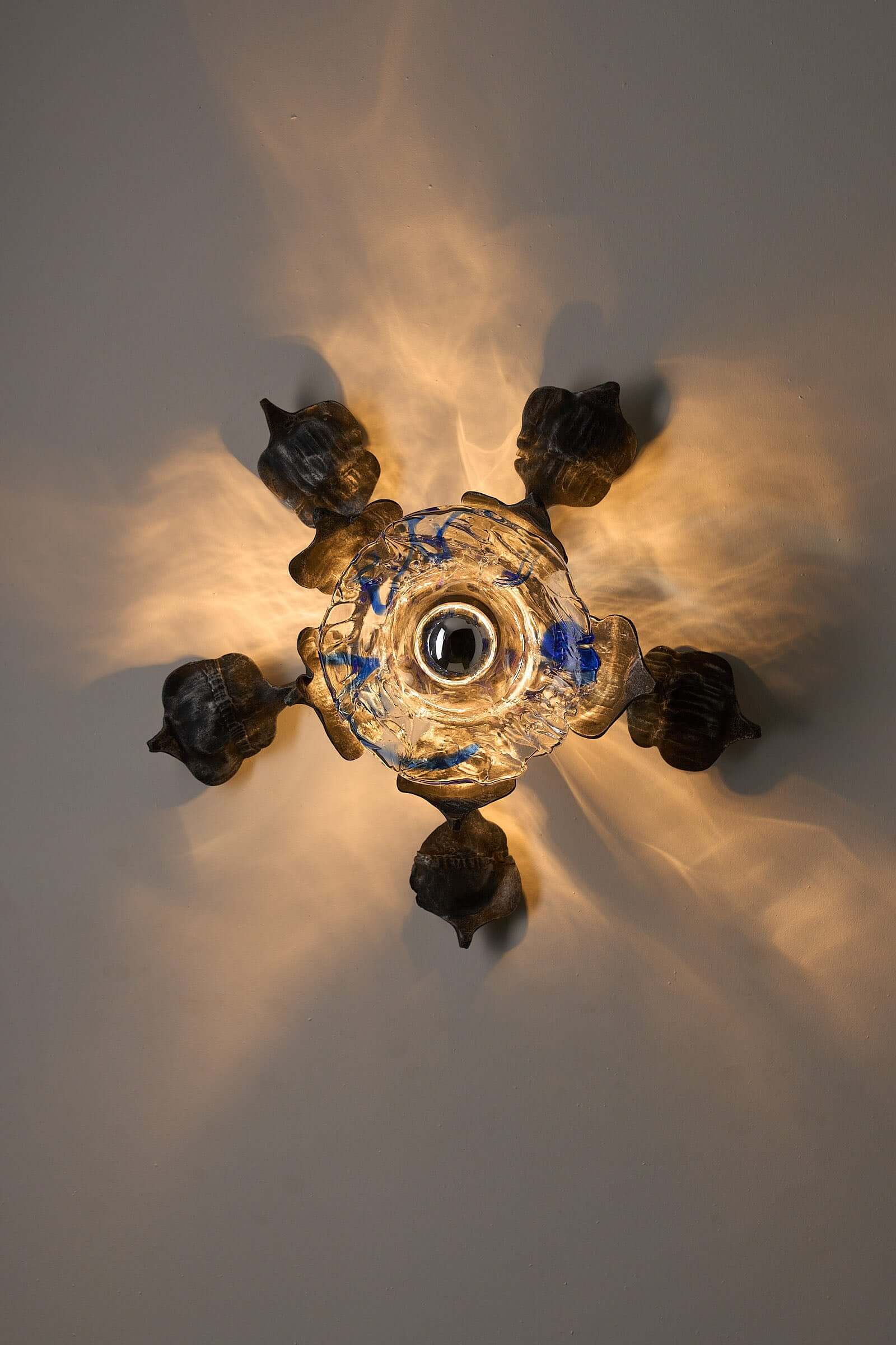 Brutalist Wall Sconce Cast Iron and Murano Glass by Ahlstrom & Ehrlich illuminated with organic design and blue accents.