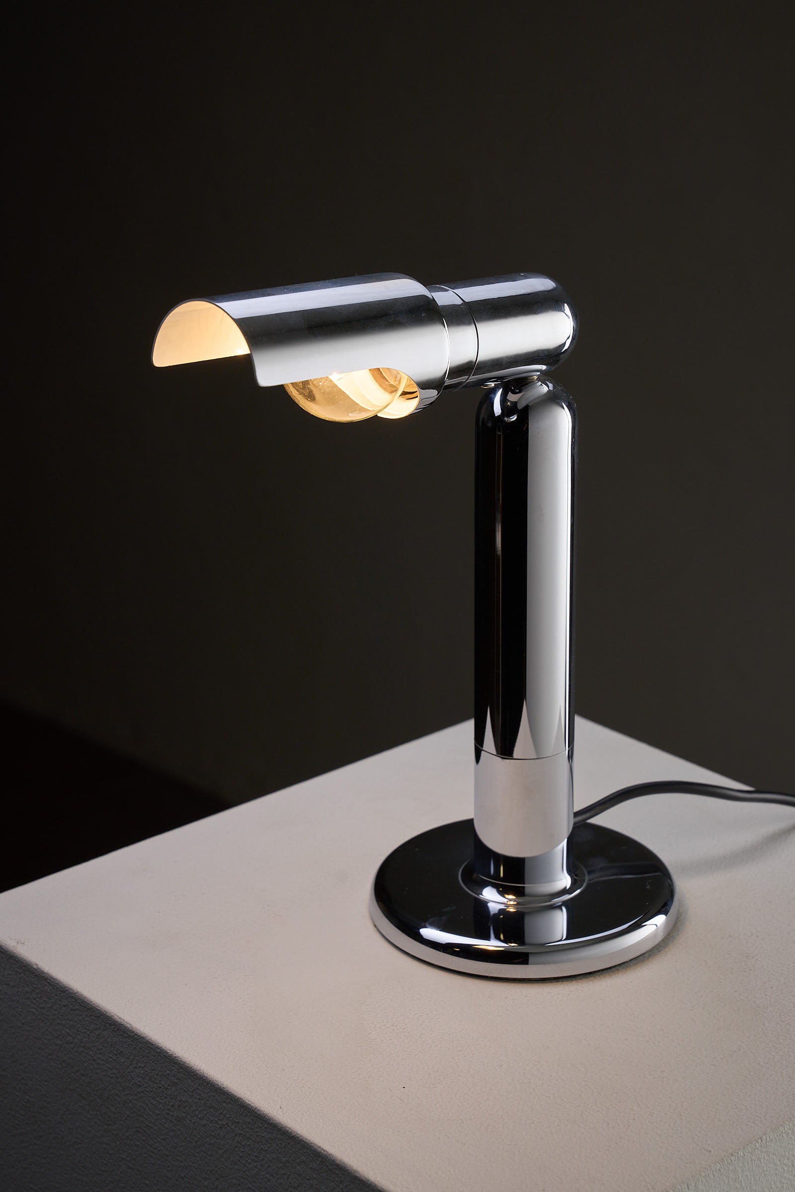 Chrome Adjustable Desk Lamp Model 7962 By Cosack with adjustable shade and polished base, ideal for outdoor lighting.