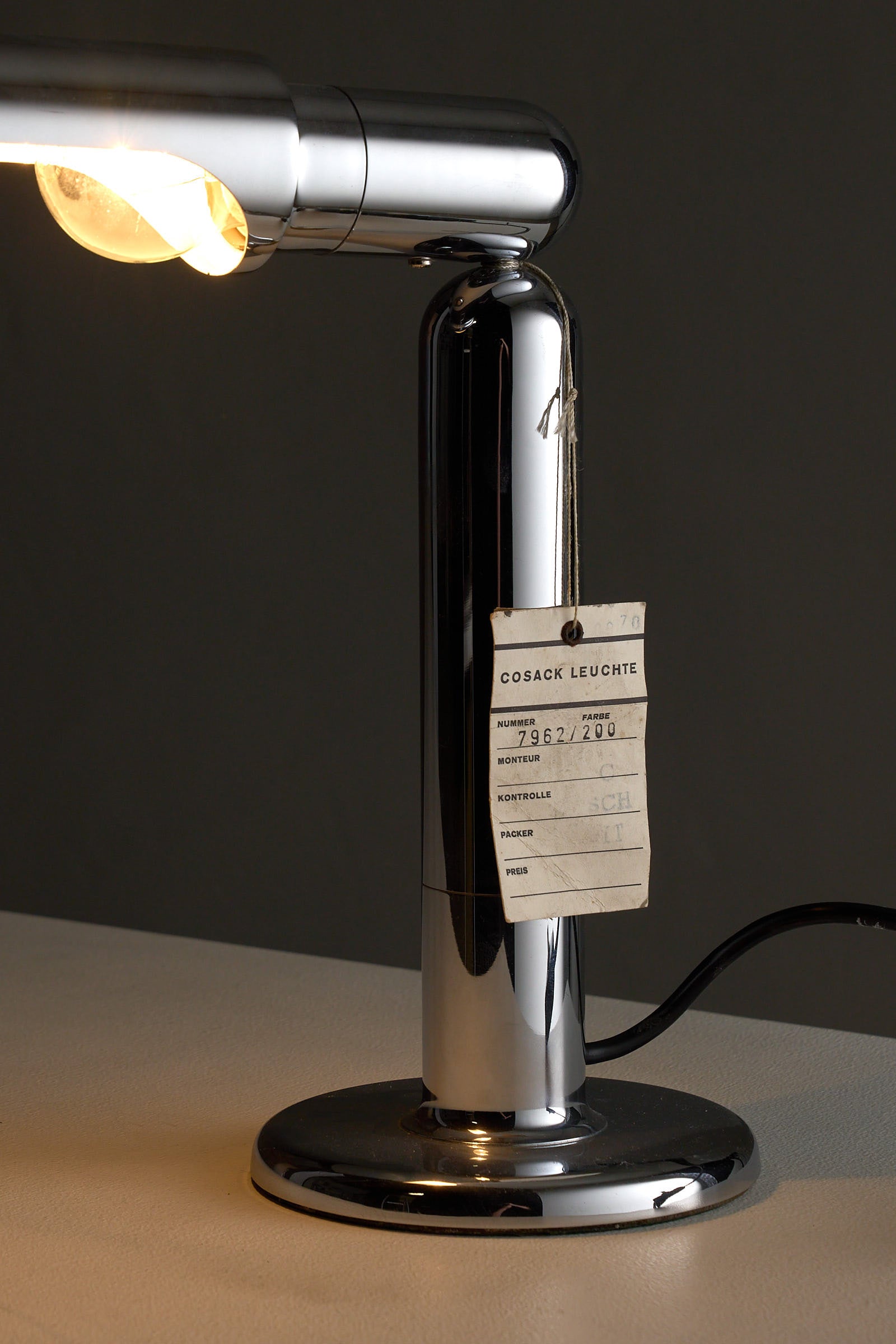 Chrome Adjustable Desk Lamp Model 7962 By Cosack with a polished chrome base and adjustable arm.