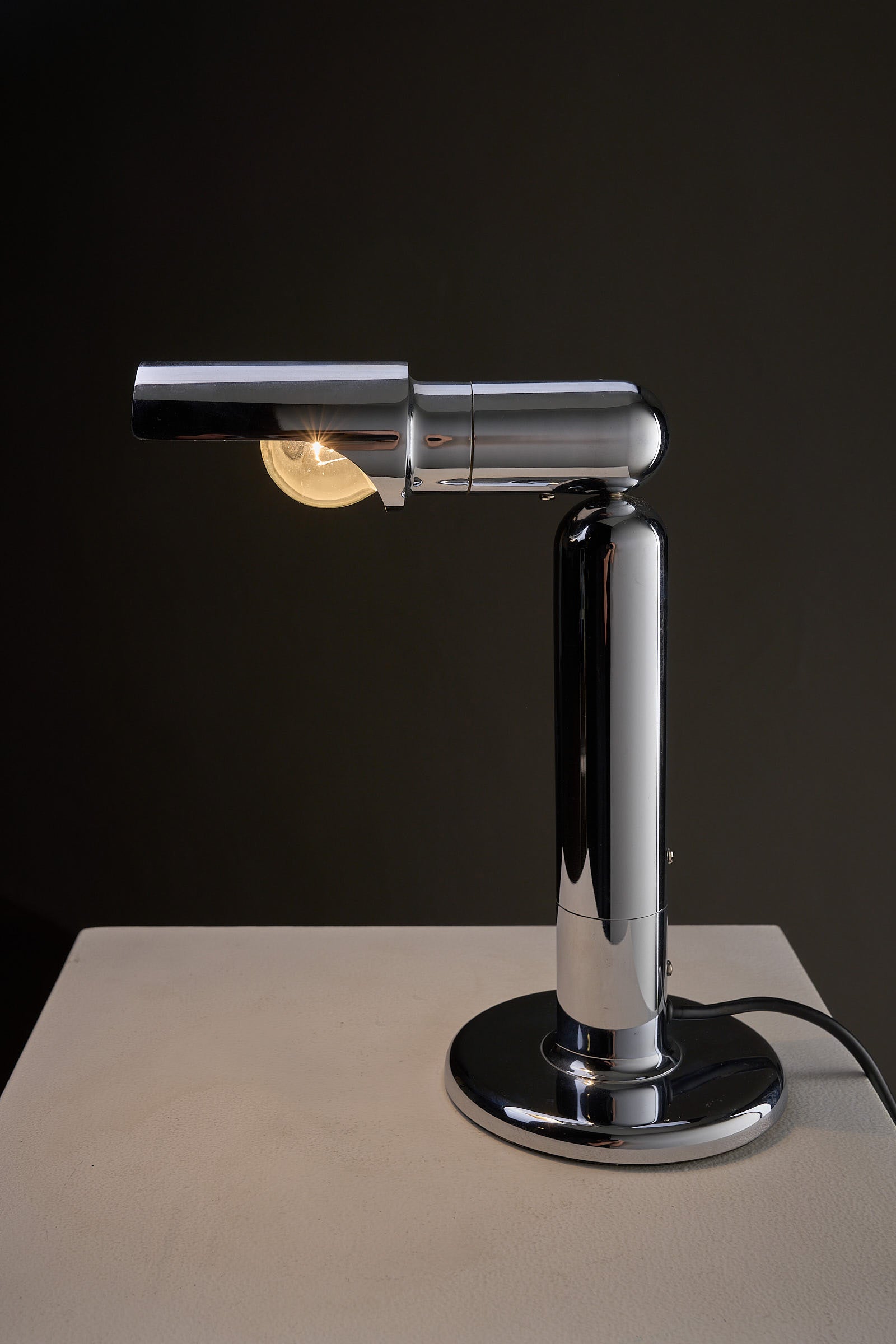 Chrome Adjustable Desk Lamp Model 7962 By Cosack with adjustable shade and polished chrome finish on a modern base.
