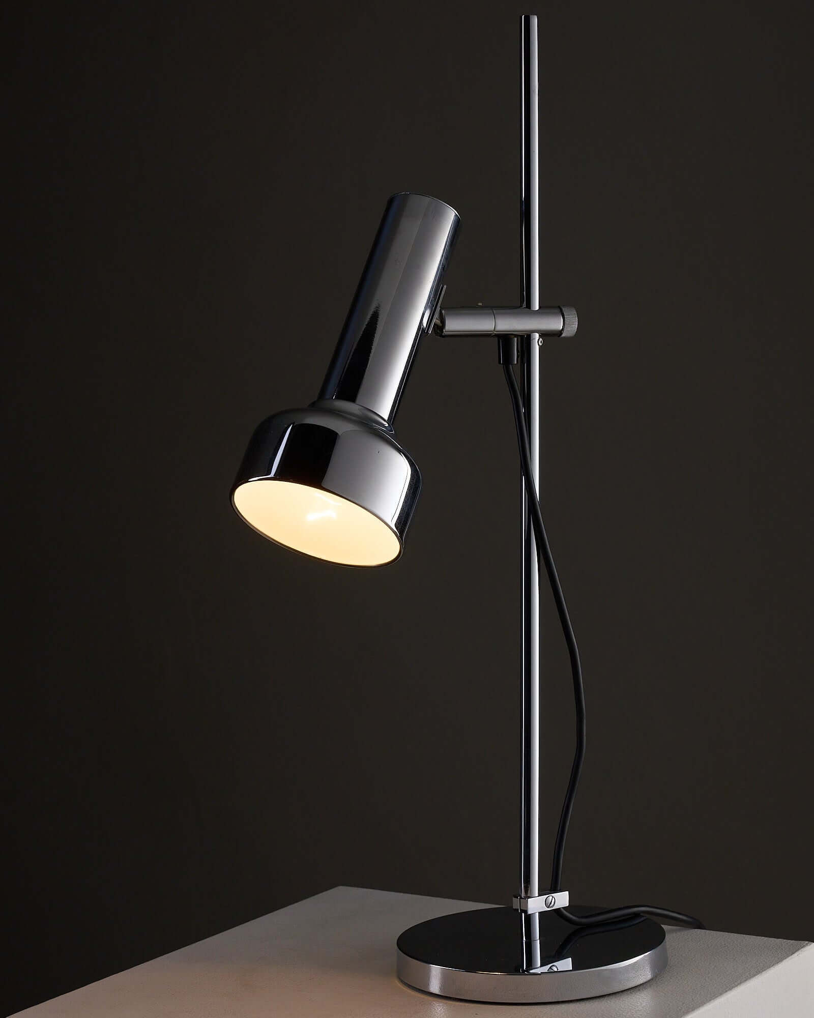 Adjustable Chrome Table Lamp Model 7973 by Cosack on a surface, showcasing mid-century modern design and outdoor lighting features.