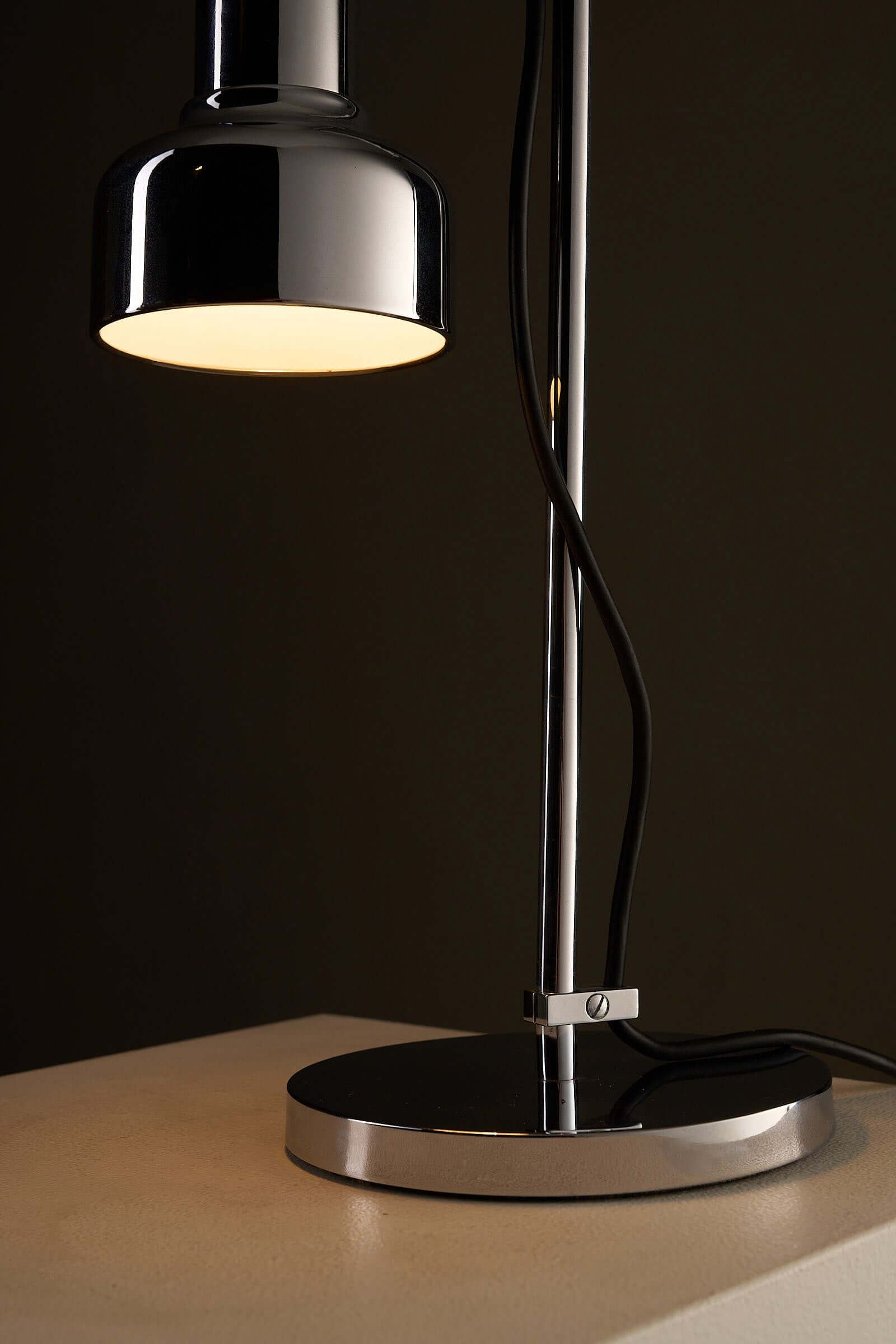 Adjustable Chrome Table Lamp Model 7973 by Cosack showcasing its chrome finish and sliding clamp for height adjustment.