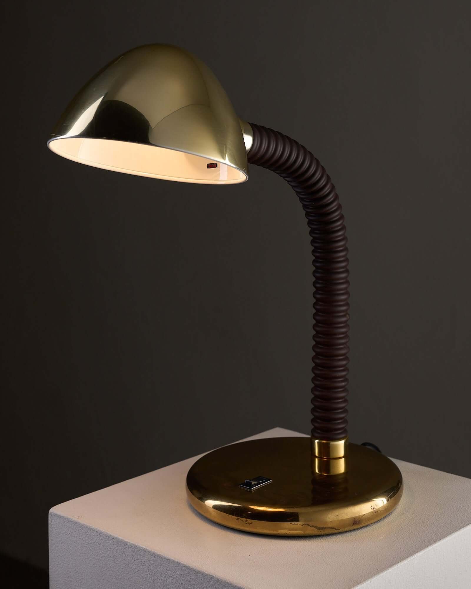 Brass And Brown Gooseneck Desk Lamp Model 7656 By Cosack featuring polished brass shade and flexible gooseneck.