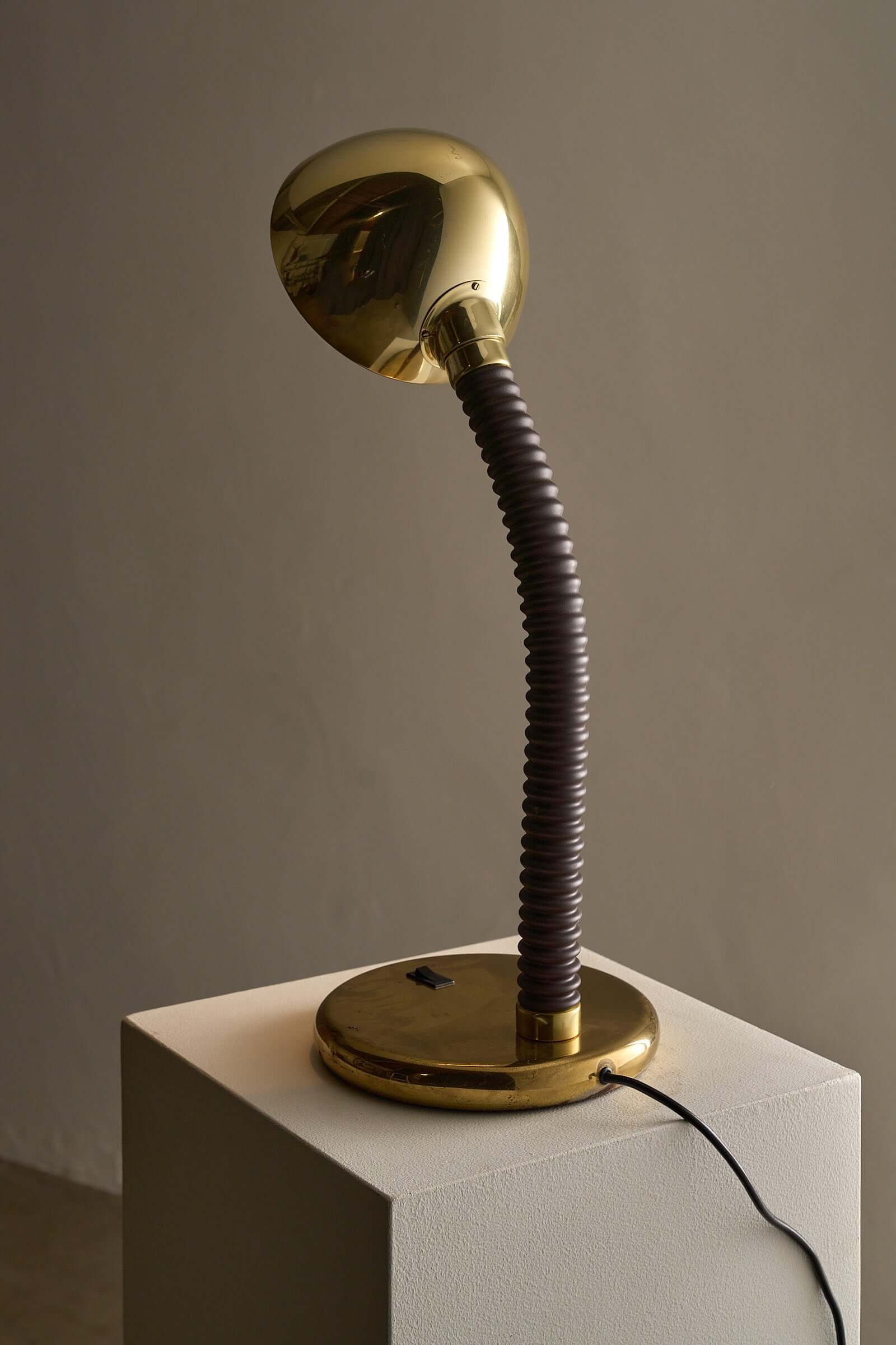 Brass And Brown Gooseneck Desk Lamp Model 7656 By Cosack on display with adjustable gooseneck for precise lighting.