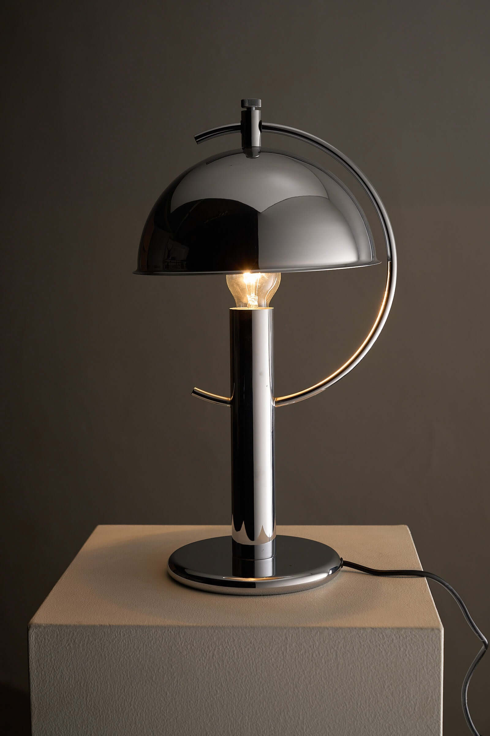Cosack Chrome Semi-Sphere Desk Lamp with adjustable shade and chrome finish for modern outdoor lighting.