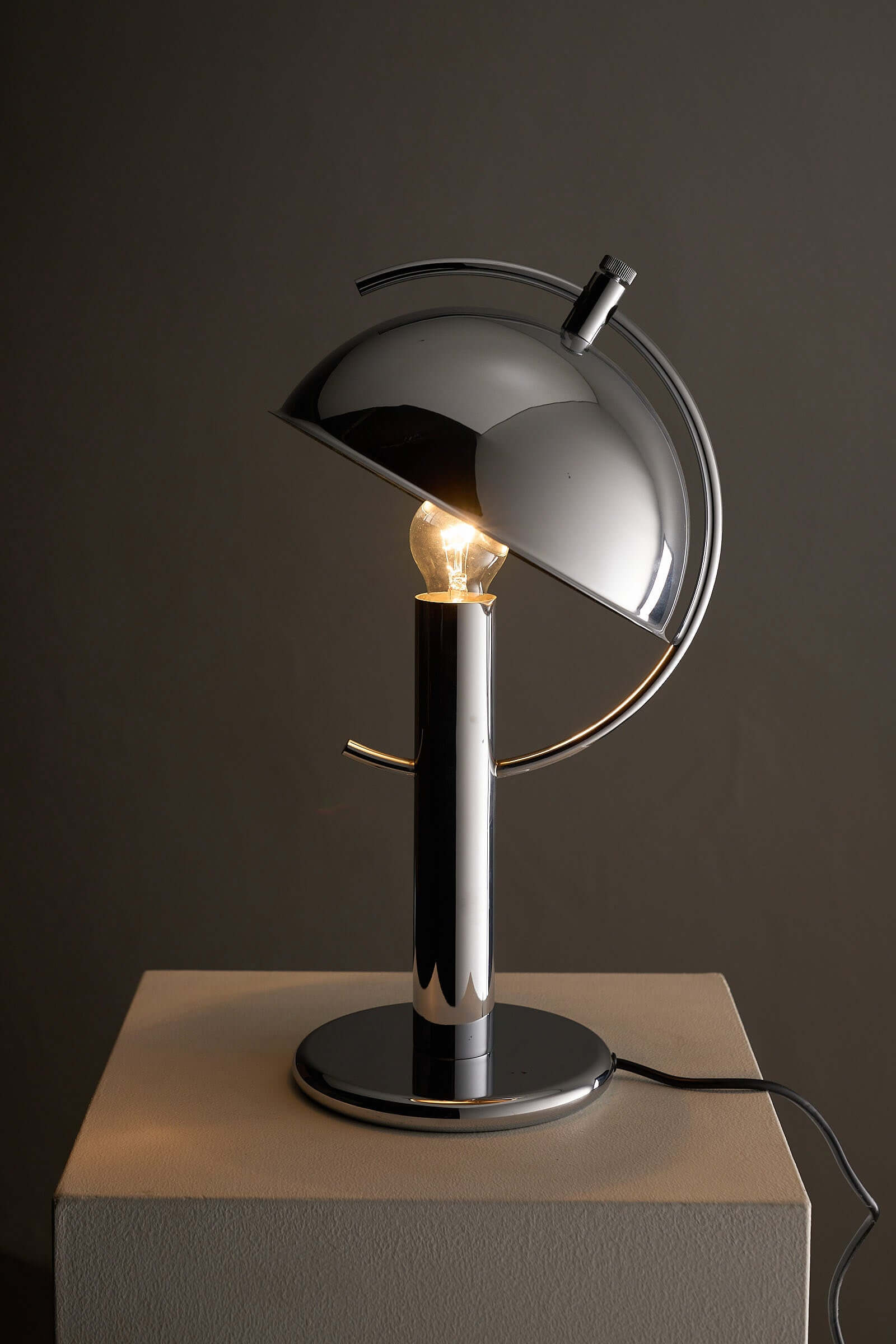 Cosack Chrome Semi-Sphere Desk Lamp with adjustable reflector and chrome finish, ideal for outdoor lighting.