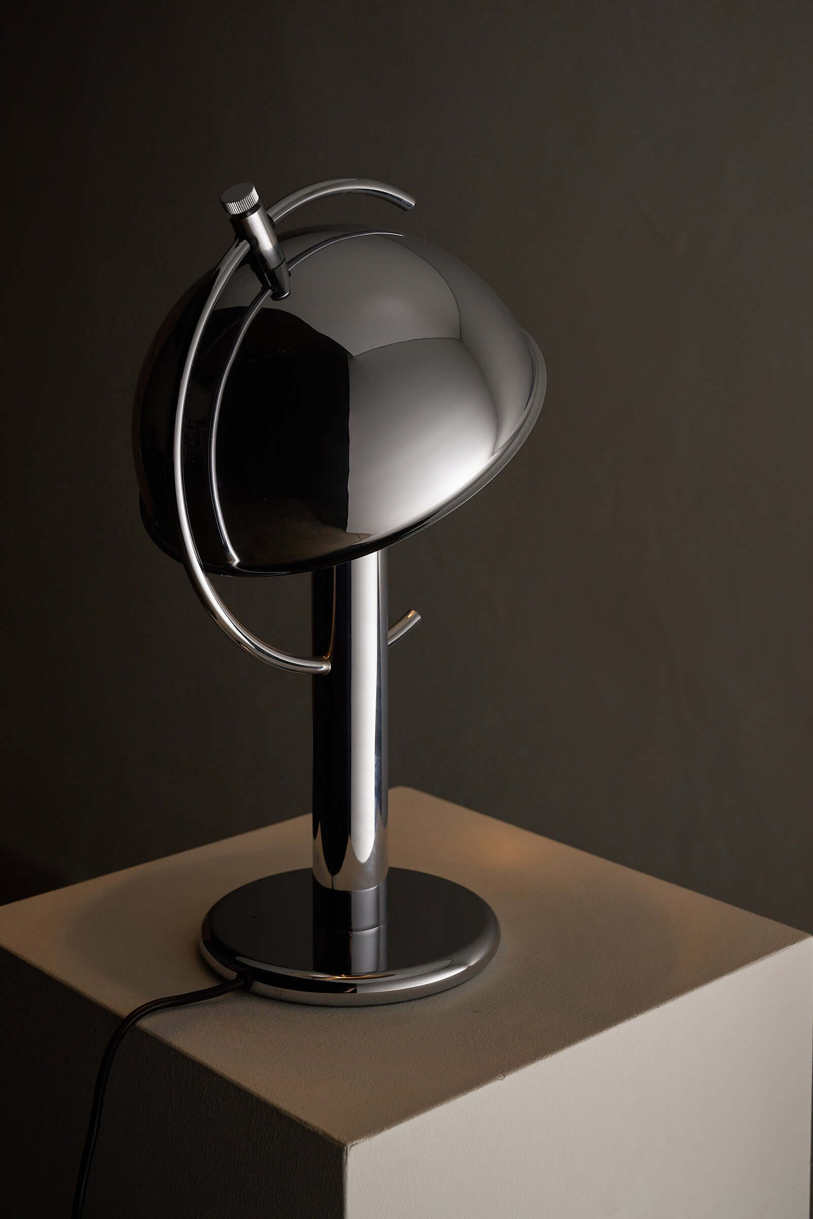 Cosack Chrome Semi-Sphere Desk Lamp with adjustable reflector and cylindrical base for outdoor lighting.