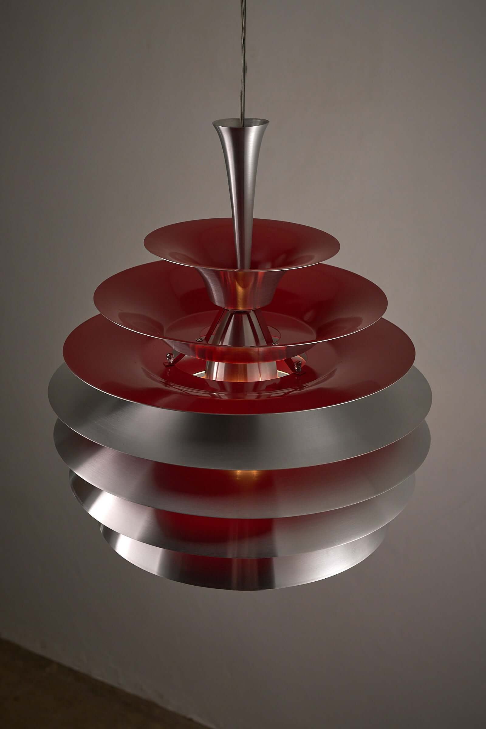 Retro Layered Aluminum Pendant Light with red interior and brushed aluminum shades, capturing post-modern Danish style.