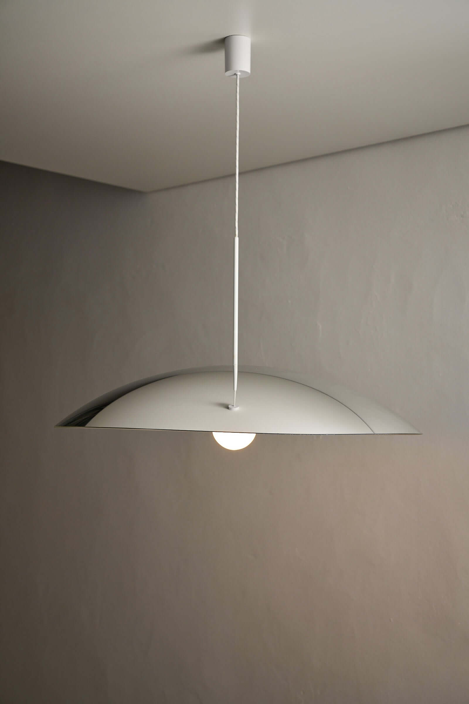 81cm Fog & Mørup Mirrored Ceiling Lamp illuminating a modern interior with minimalist design.