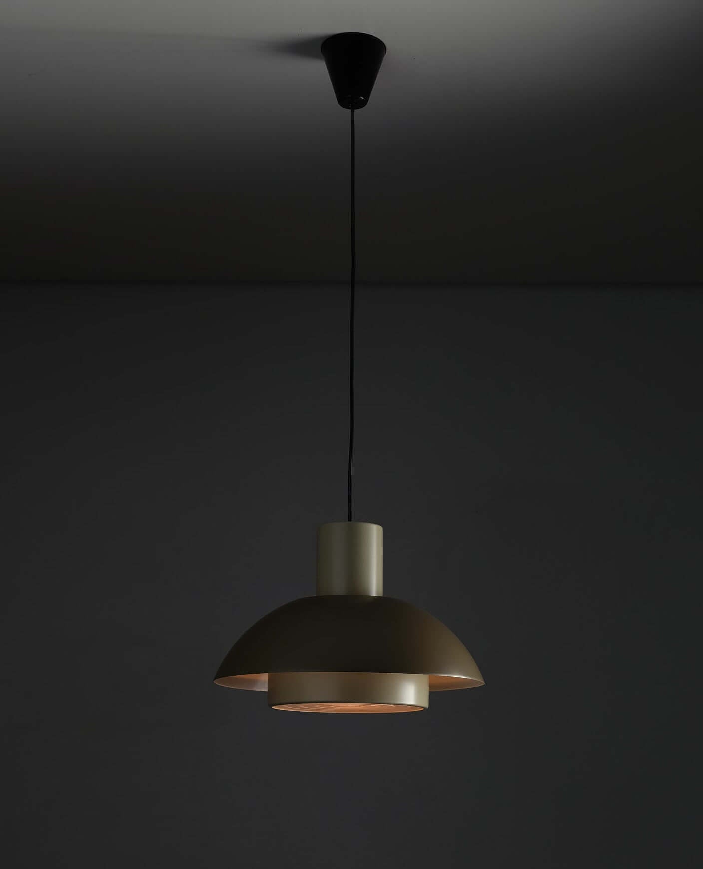 Jo Hammerborg 'Lakaj' Pendant Light (NOS) hanging from the ceiling, featuring a sleek, modern design with a cylindrical neck and dome shade.