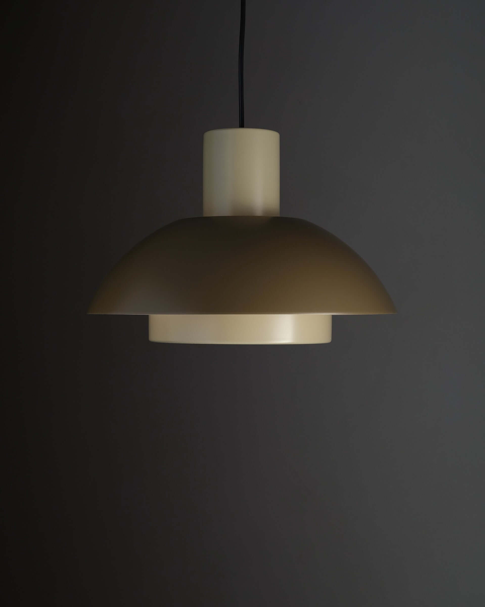 Jo Hammerborg 'Lakaj' Pendant Light (NOS) hanging against a dark background, showcasing its unique architectural design.