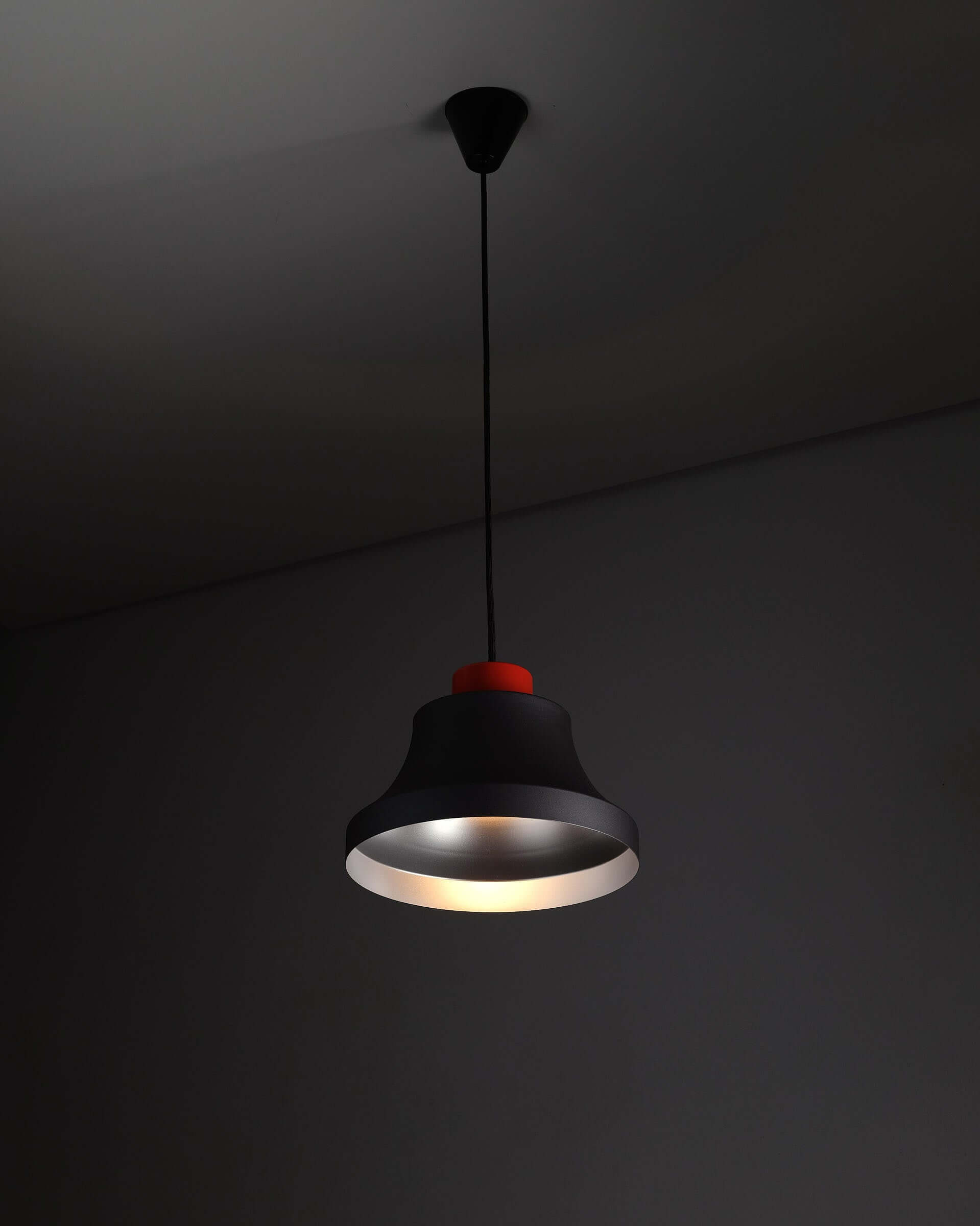 Jo Hammerborg 'Cinderella' Pendant Light in Black and Red (NOS) hanging from a ceiling with a matte black shade and red top.