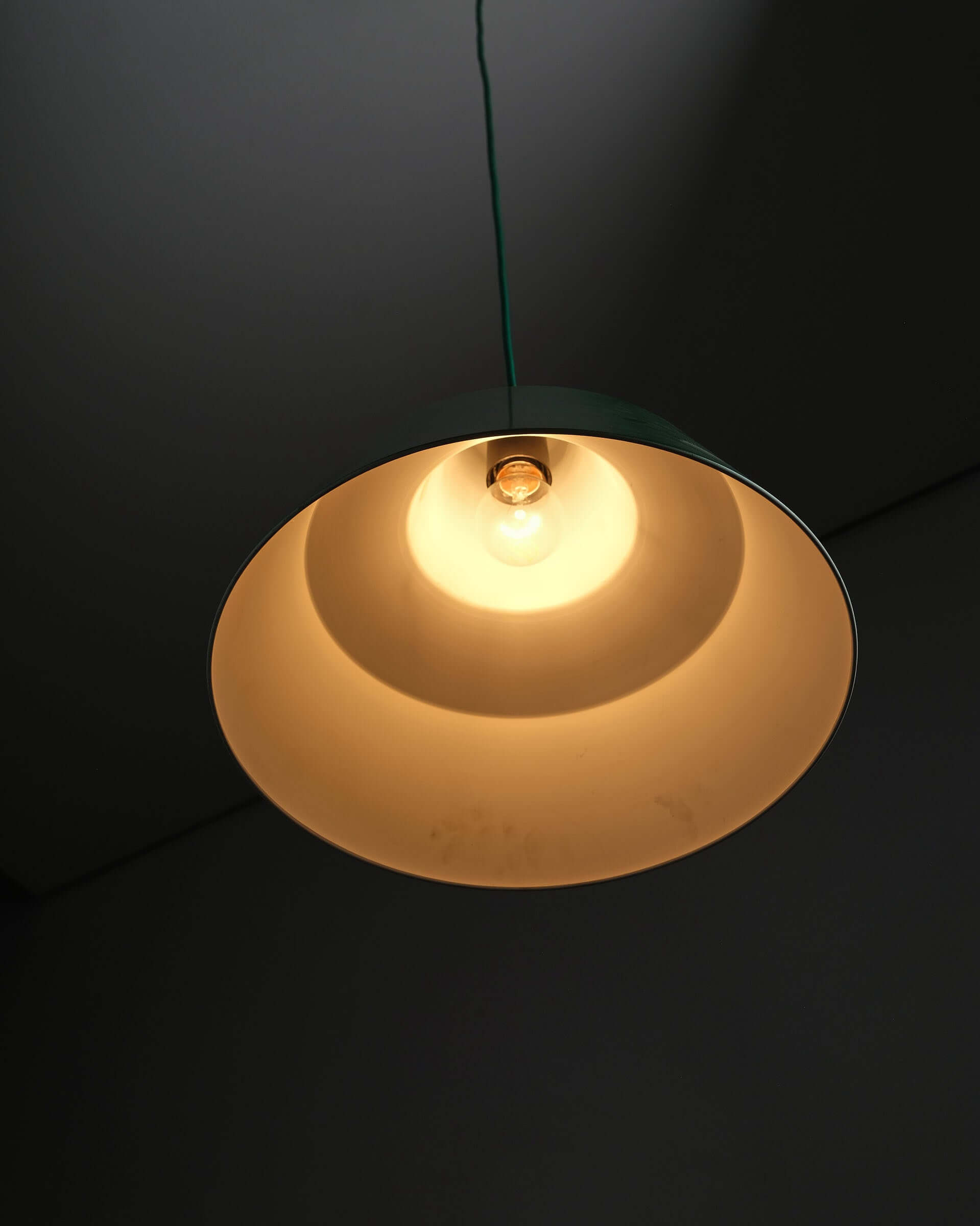 Green Danish Industrial Warehouse Pendant Light by Lyfa hanging lamp with wide shade and white interior for light reflection.