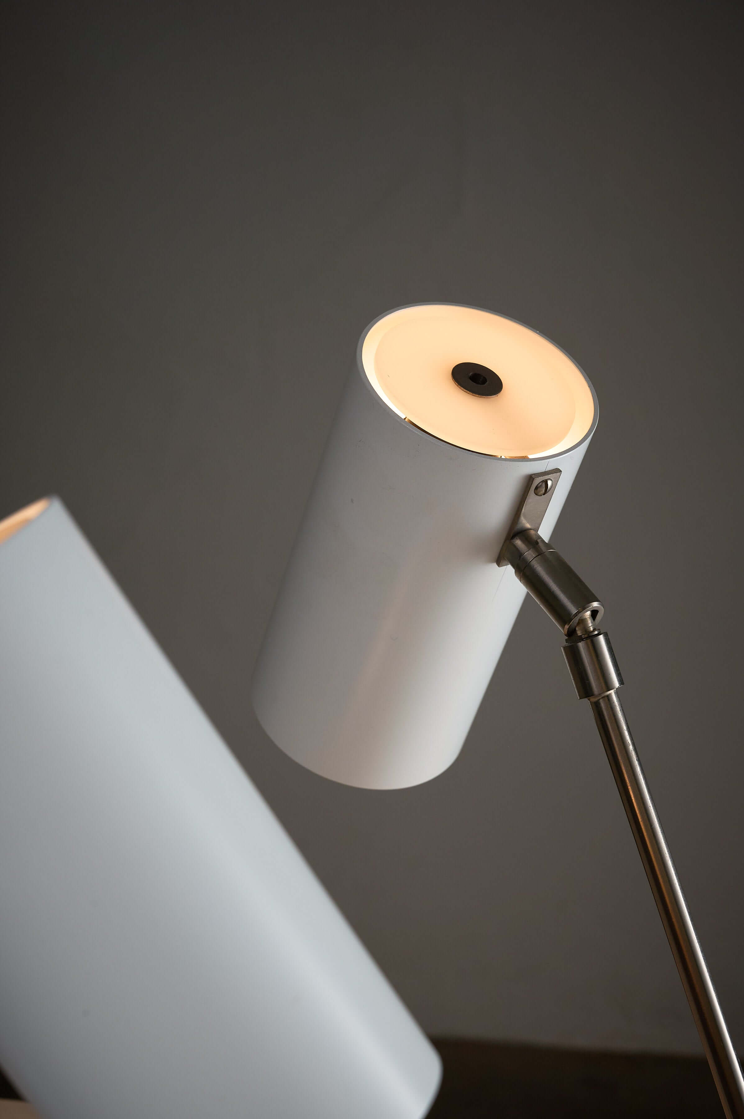 Minimalist White Cylinder Desk Lamp by Artiforte with adjustable shade for precision lighting.