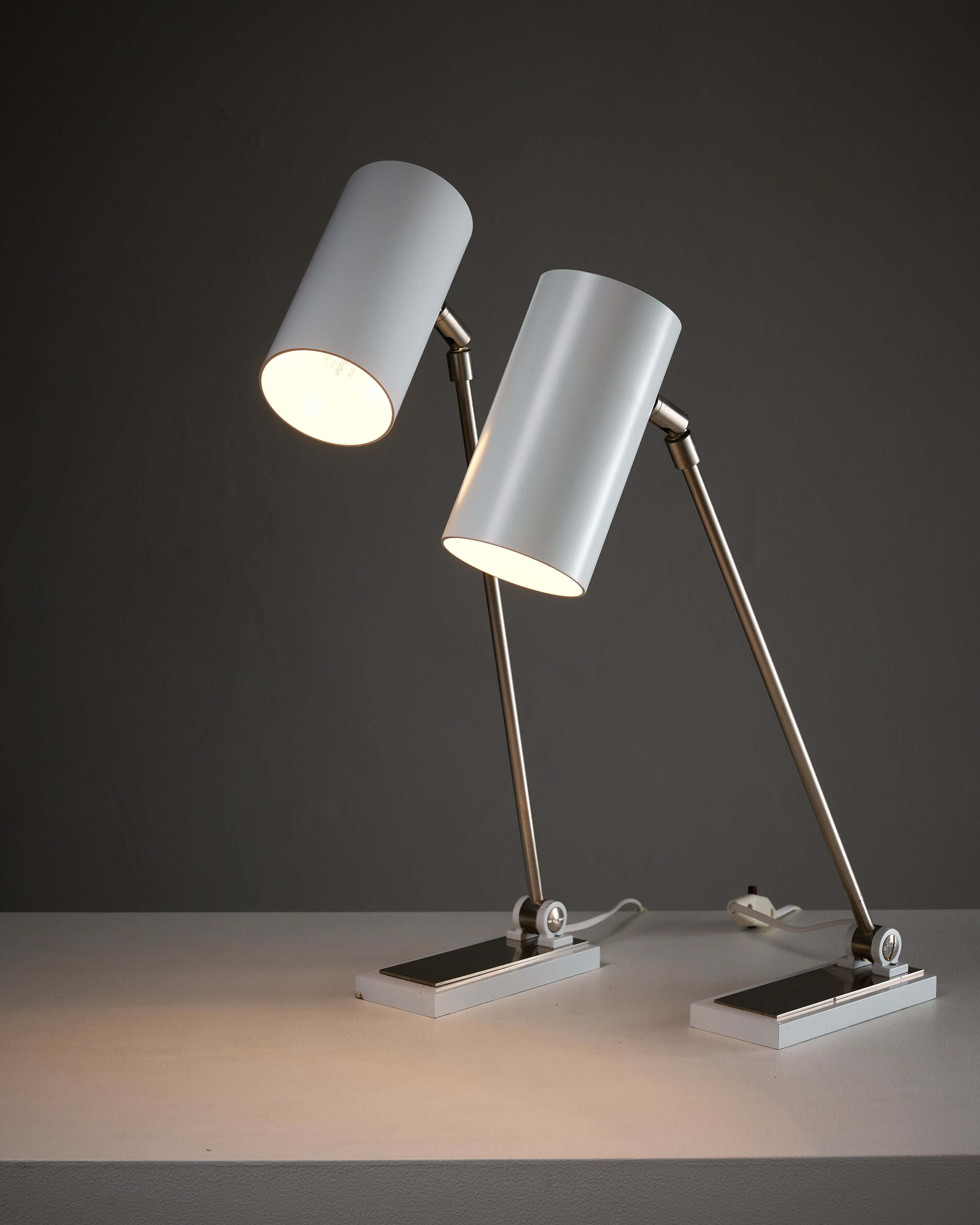 Minimalist White Cylinder Desk Lamp by Artiforte showcasing adjustable features and sleek modern design.