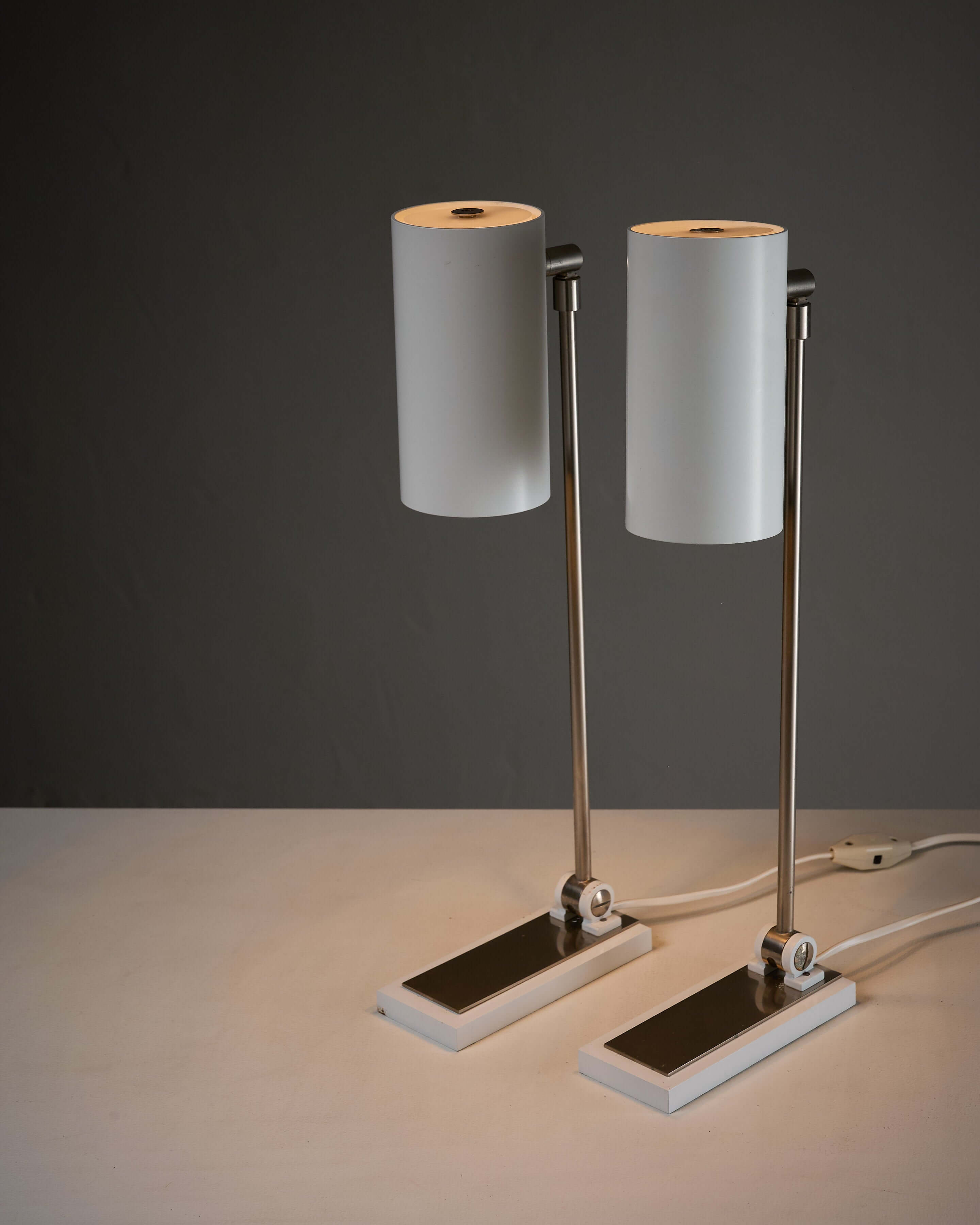 Minimalist White Cylinder Desk Lamp by Artiforte, modern design with adjustable shades and chrome base.